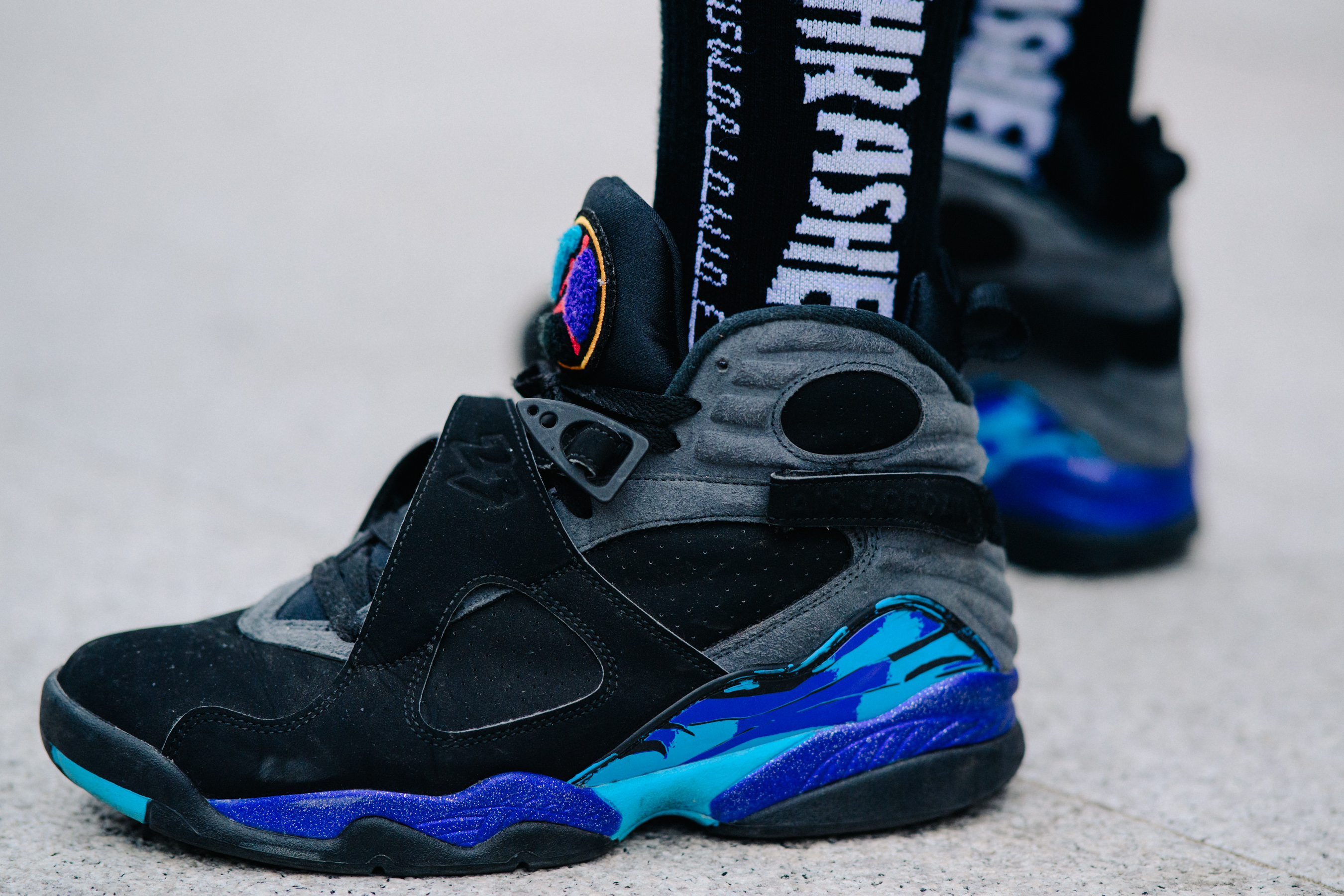 Closeup of black and blue Nike Jordan sneakers