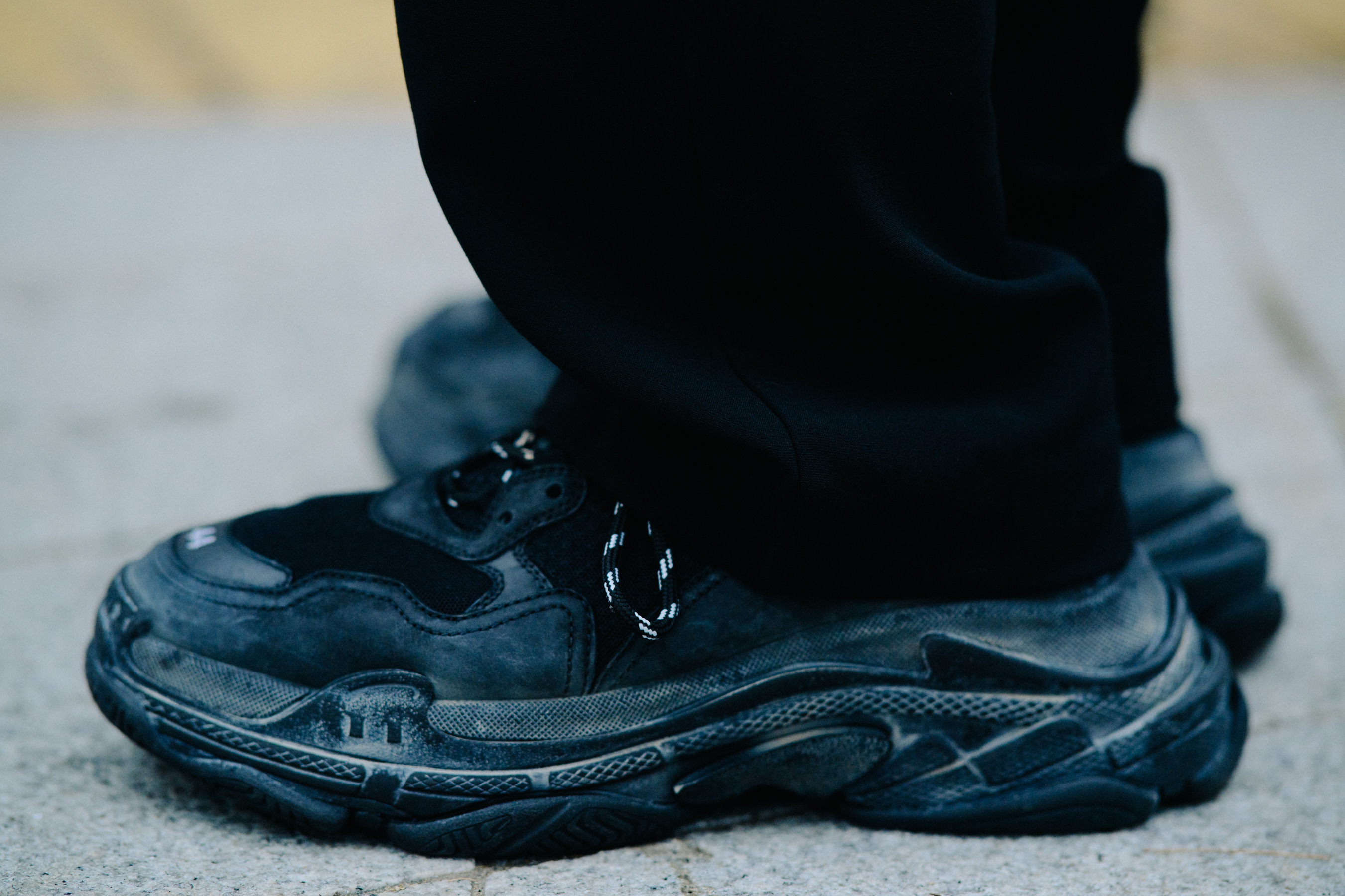 Closeup of black Balenciaga shoes
