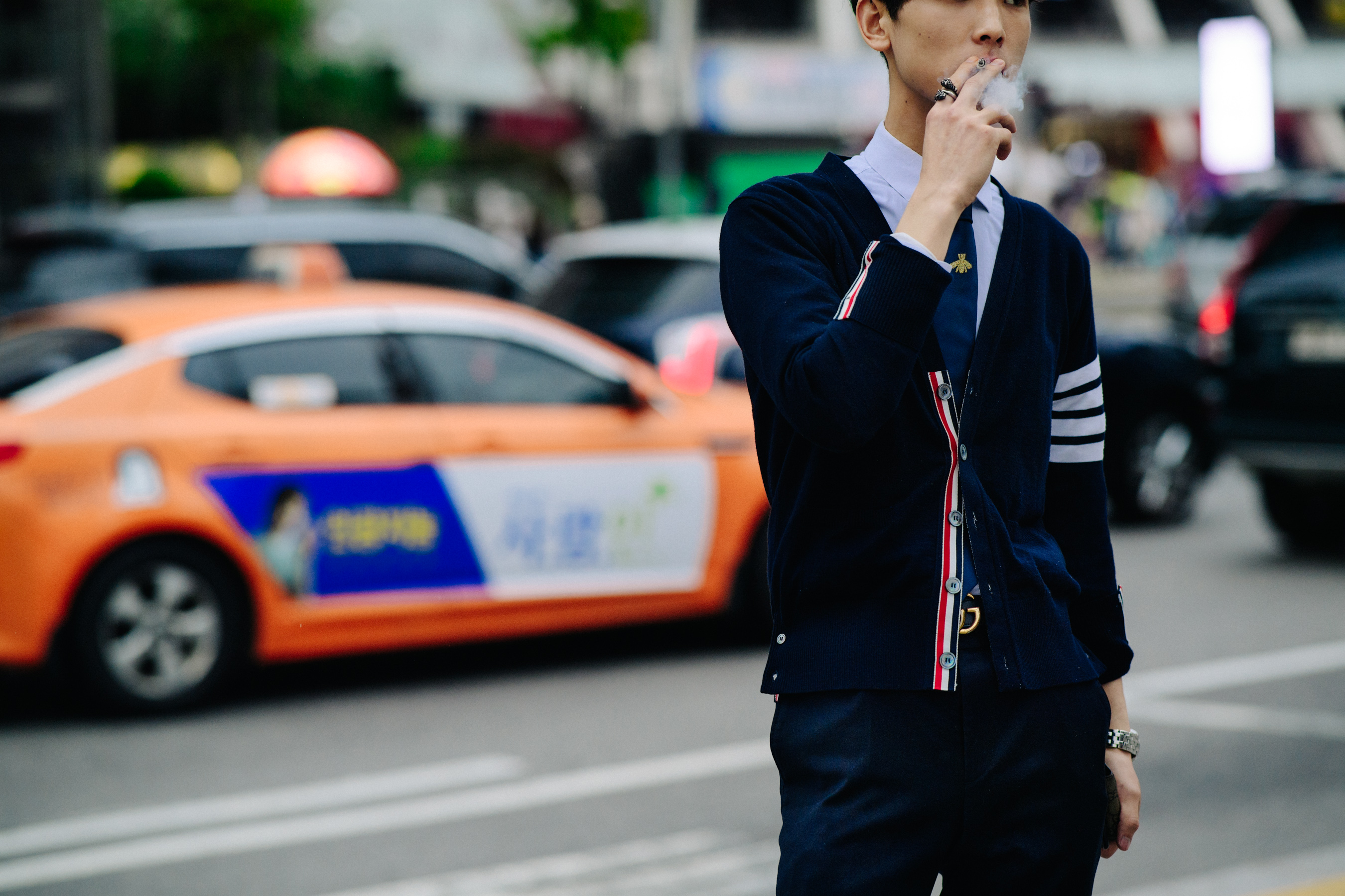 Man wearing Thom Browne cardigan