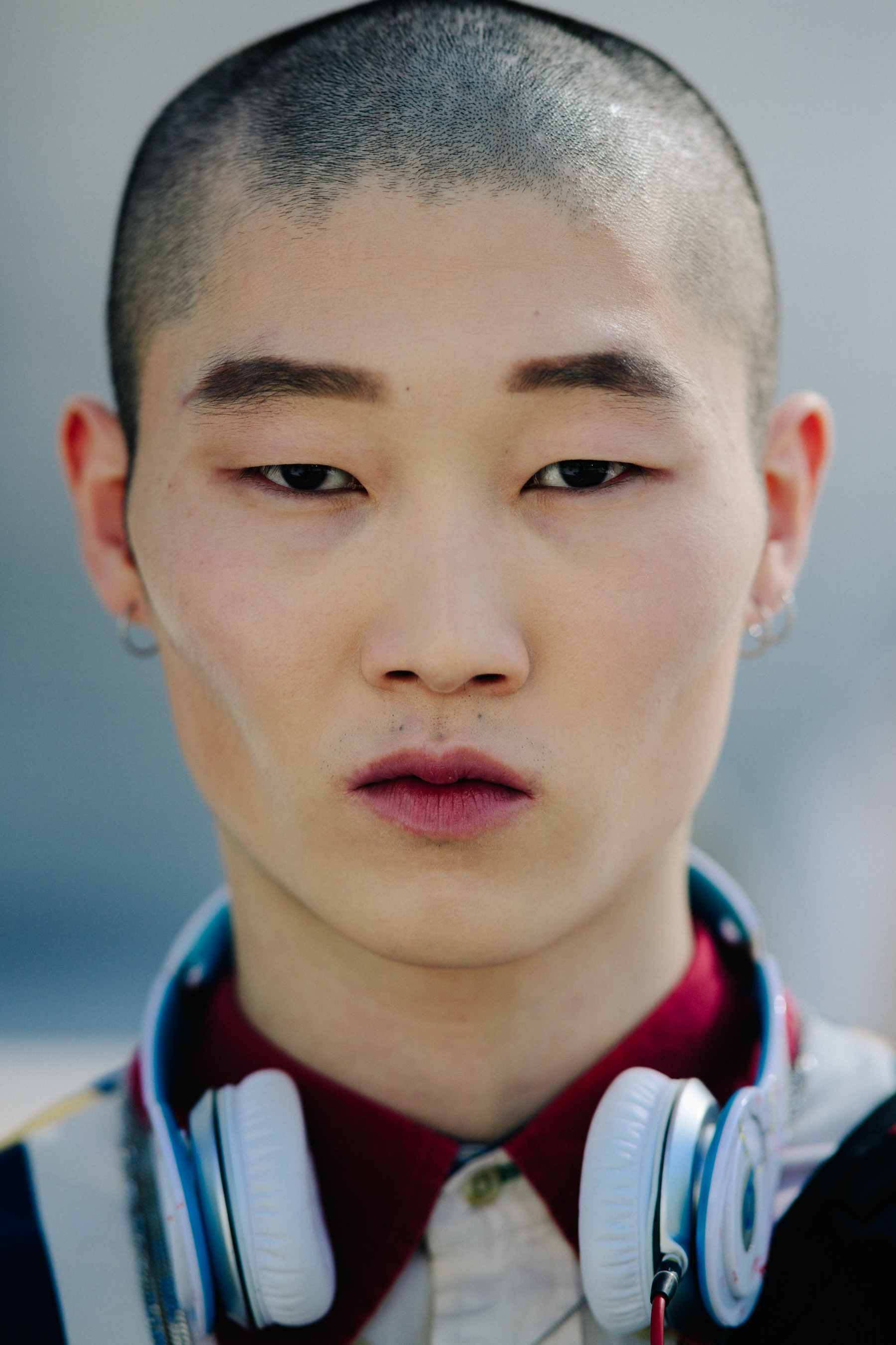 Portrait of Korean model with shaved head