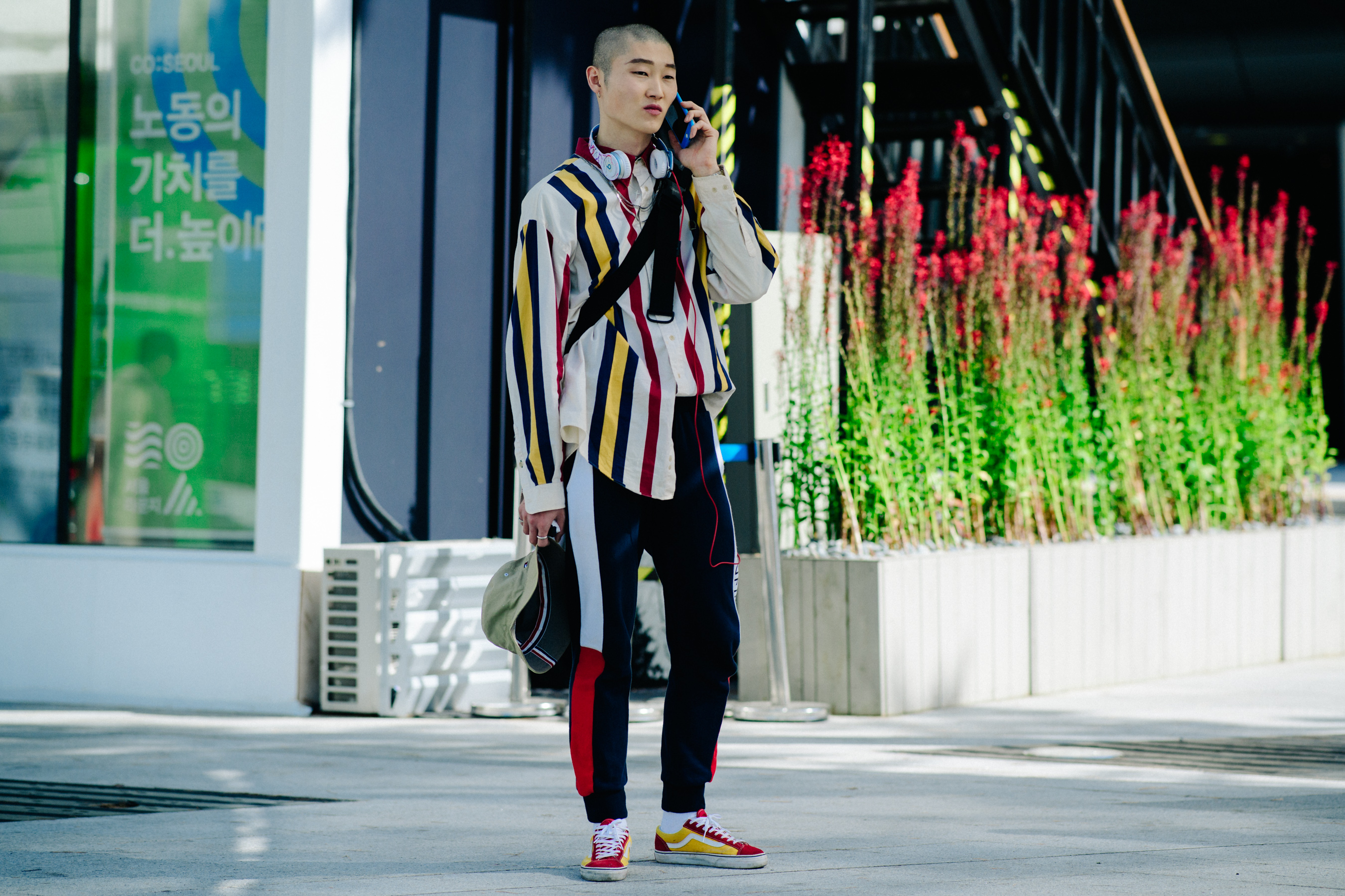 Korean model wearing striped shirt and yellow Vans