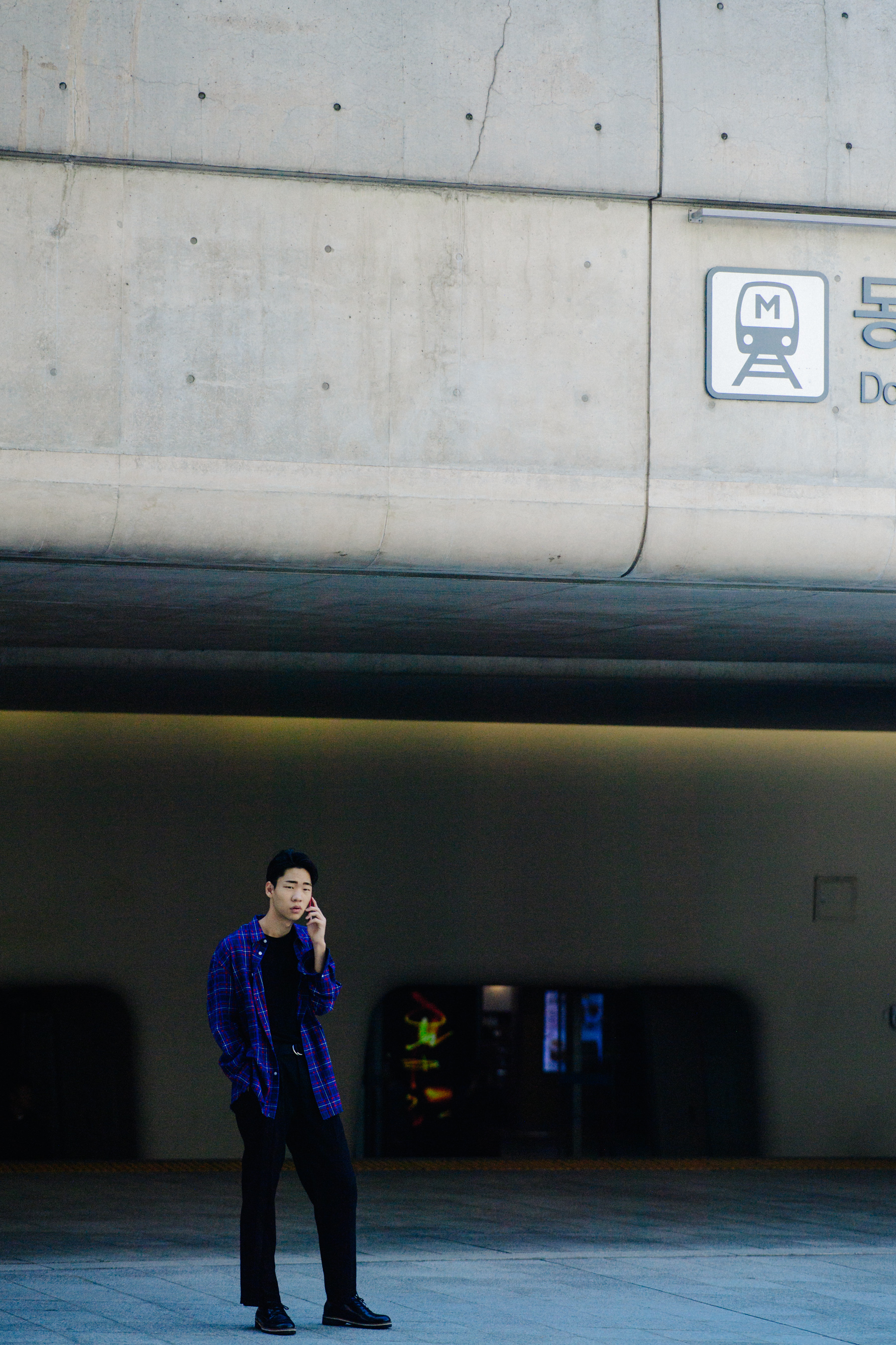 Man wearing blue and red checkered shirt