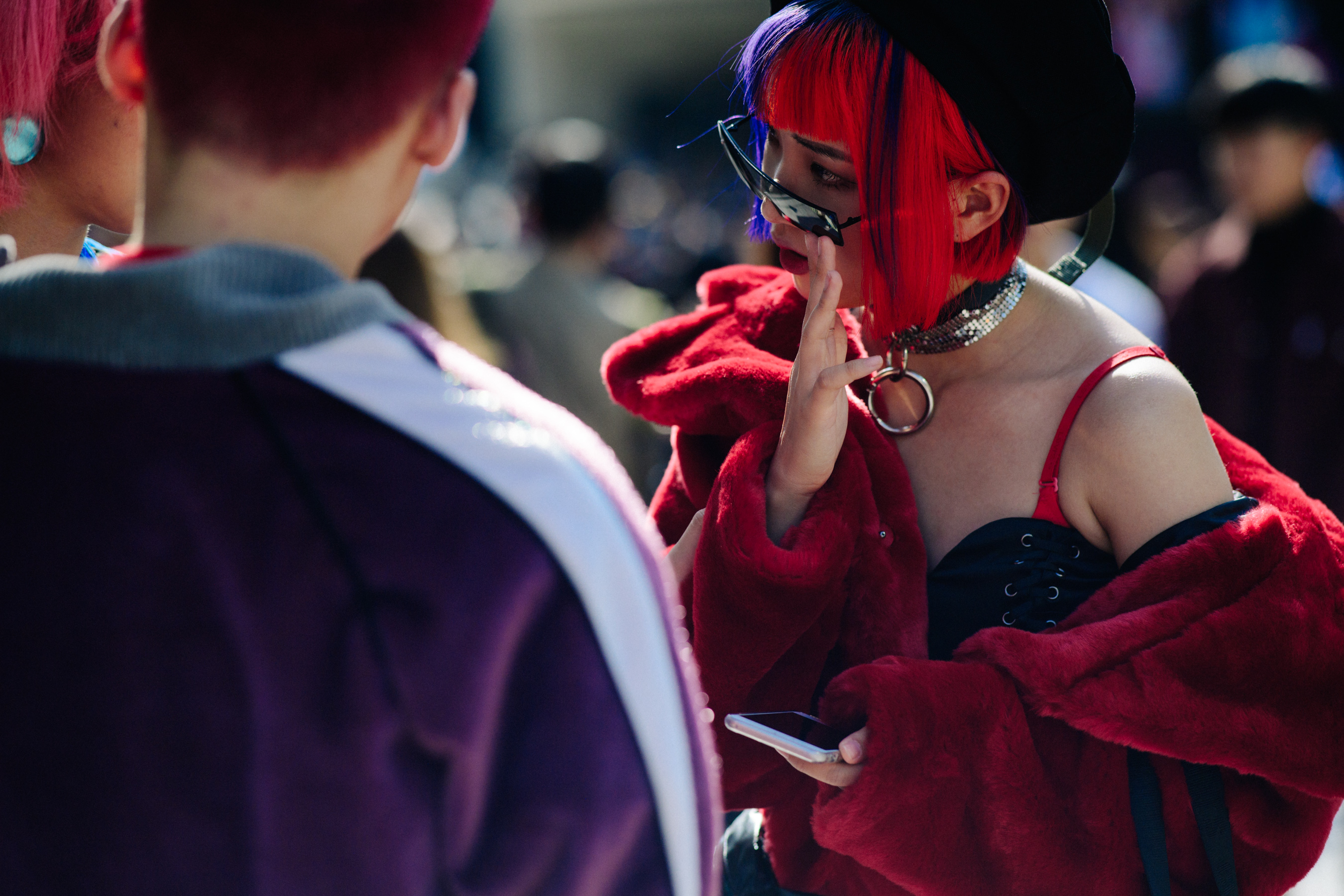Woman wearing red fur jacket