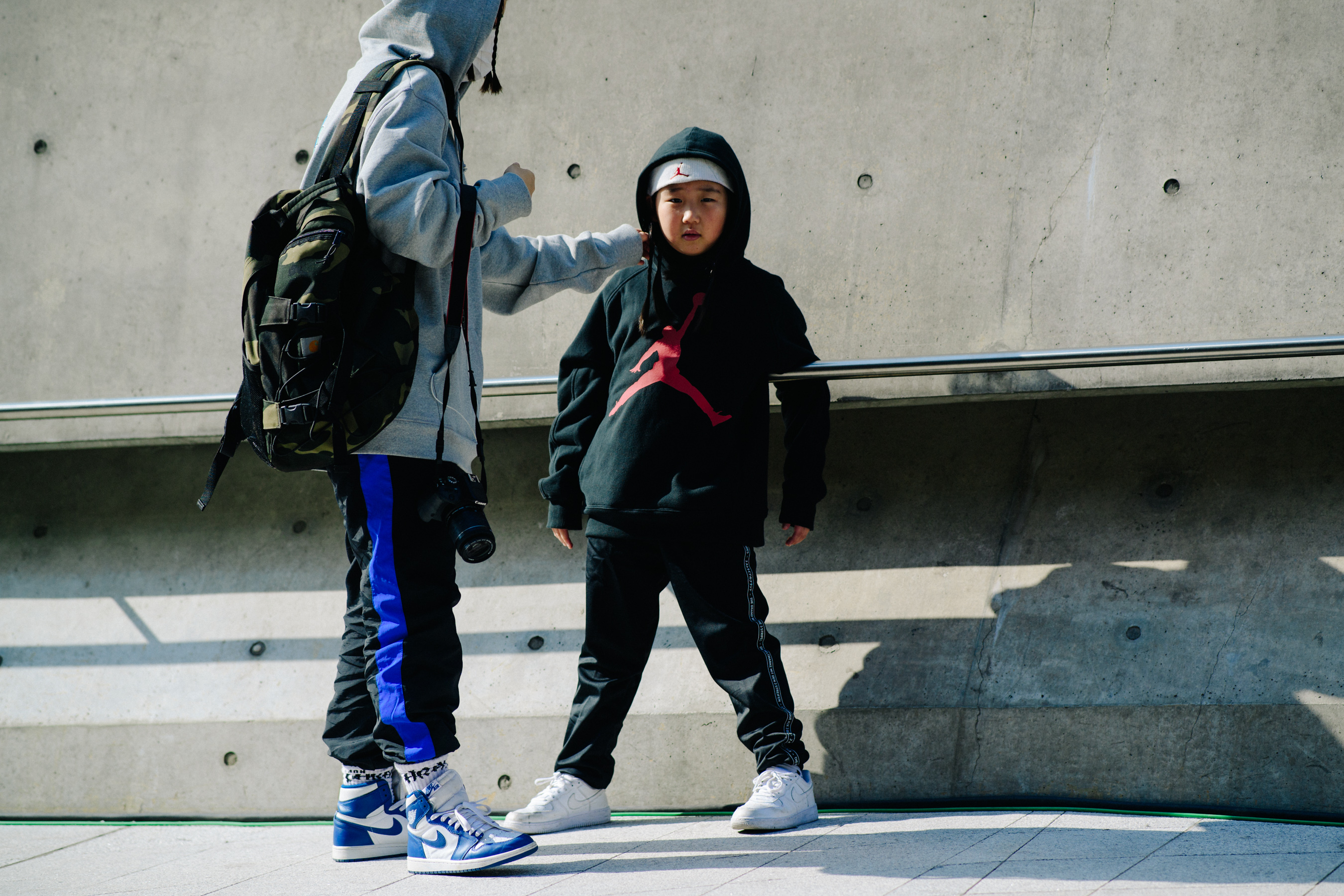 Parent and child in Nike outfits