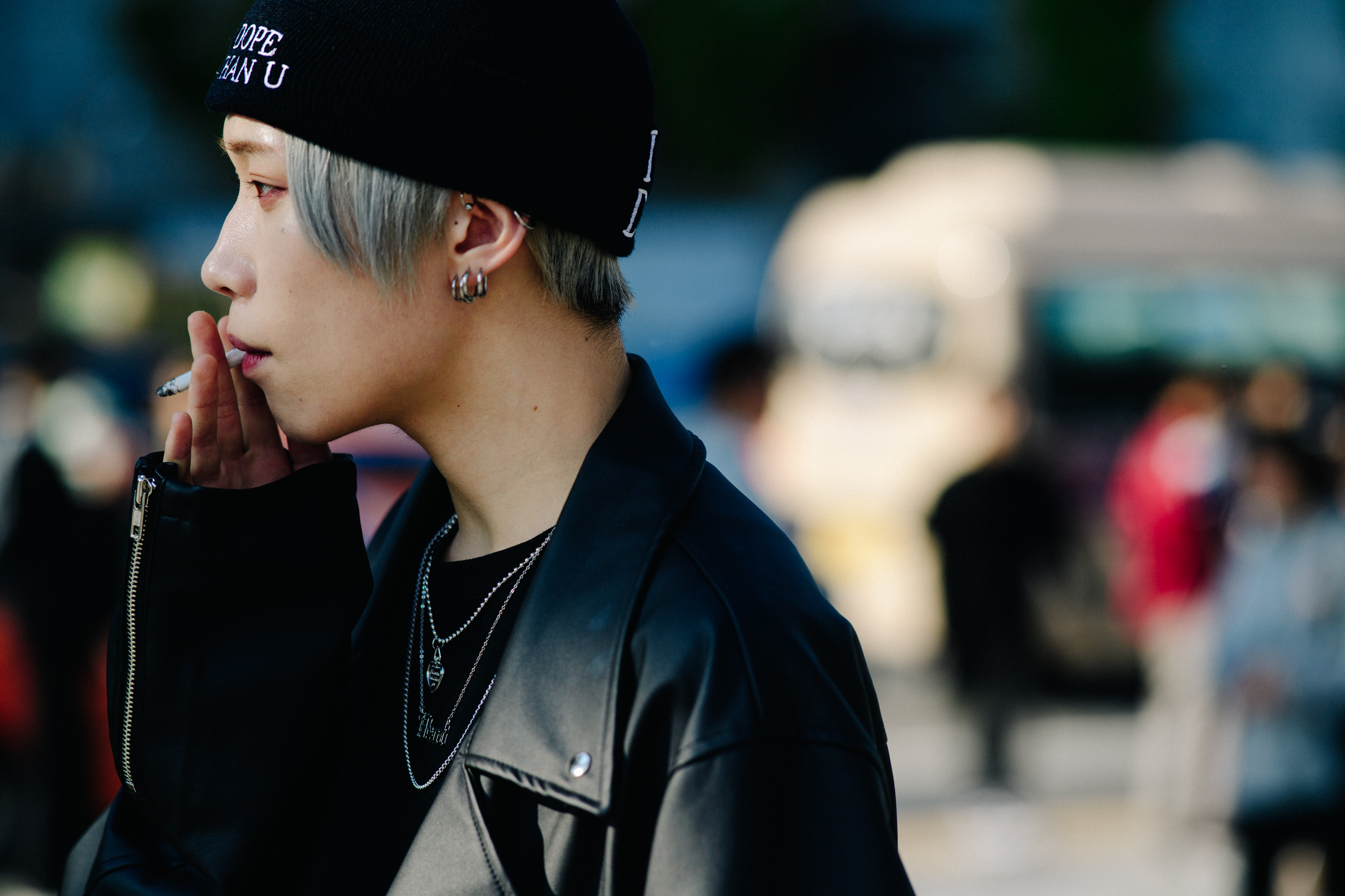 Closeup of man smoking in black beanie