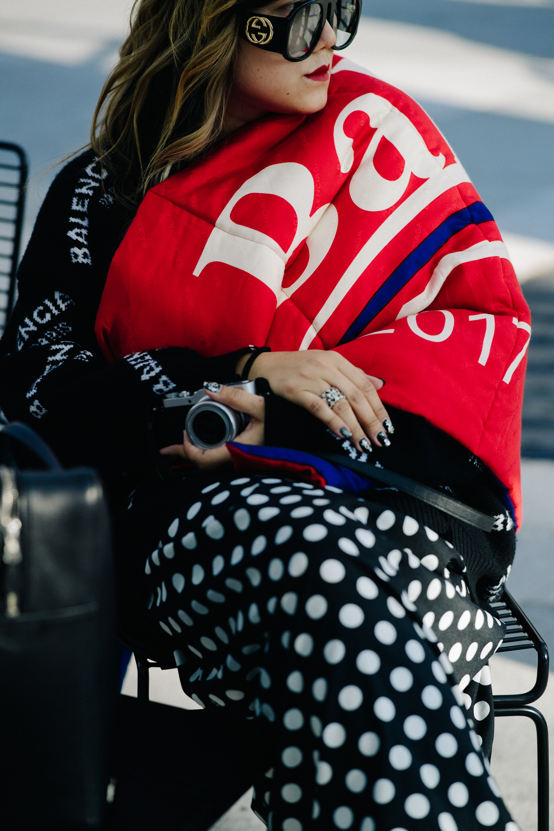 Crop of woman in Balenciaga scarf