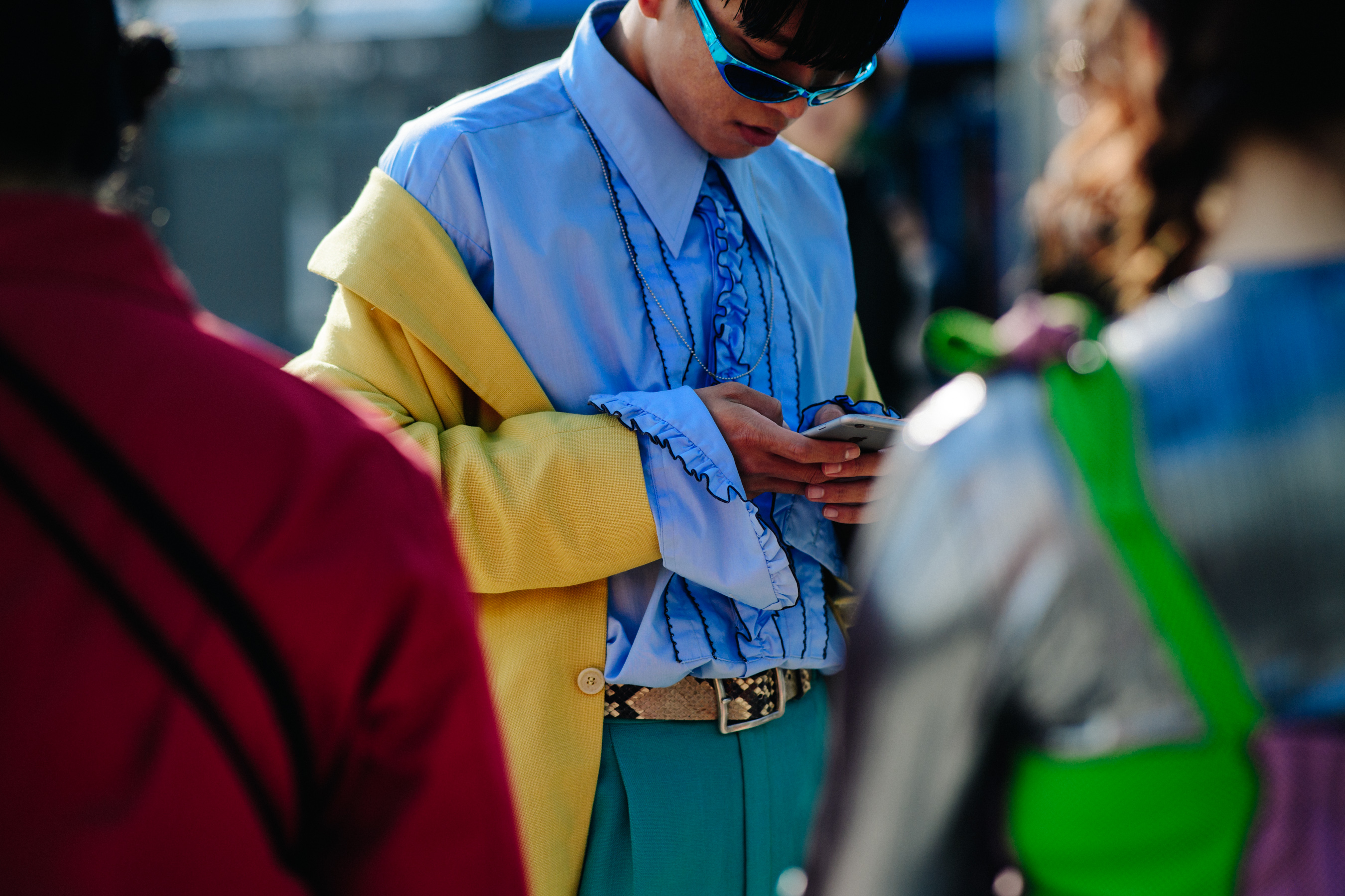 Closeup of man in blue shirt and blue sunglasses