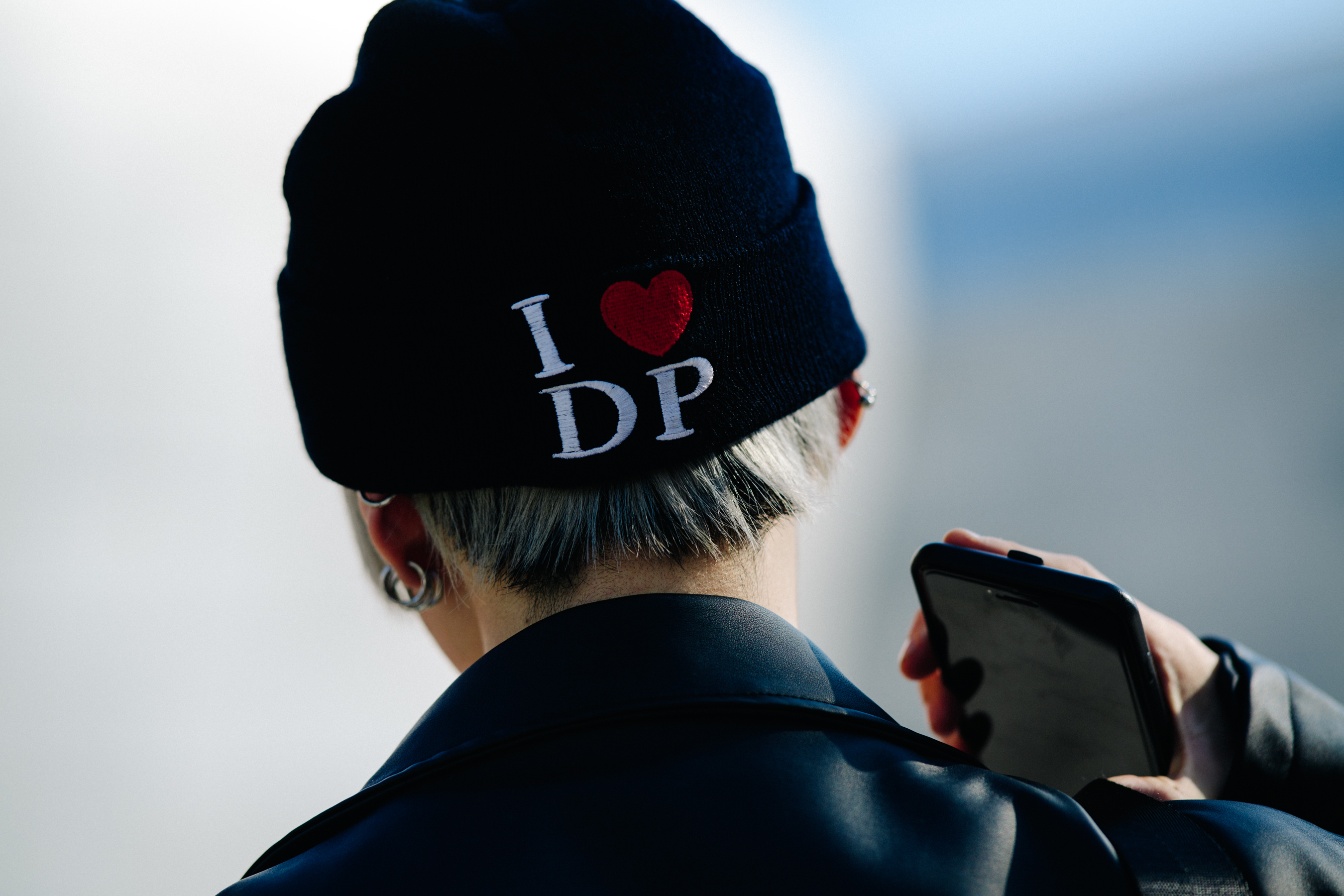 Man wearing black beanie with sewn detail