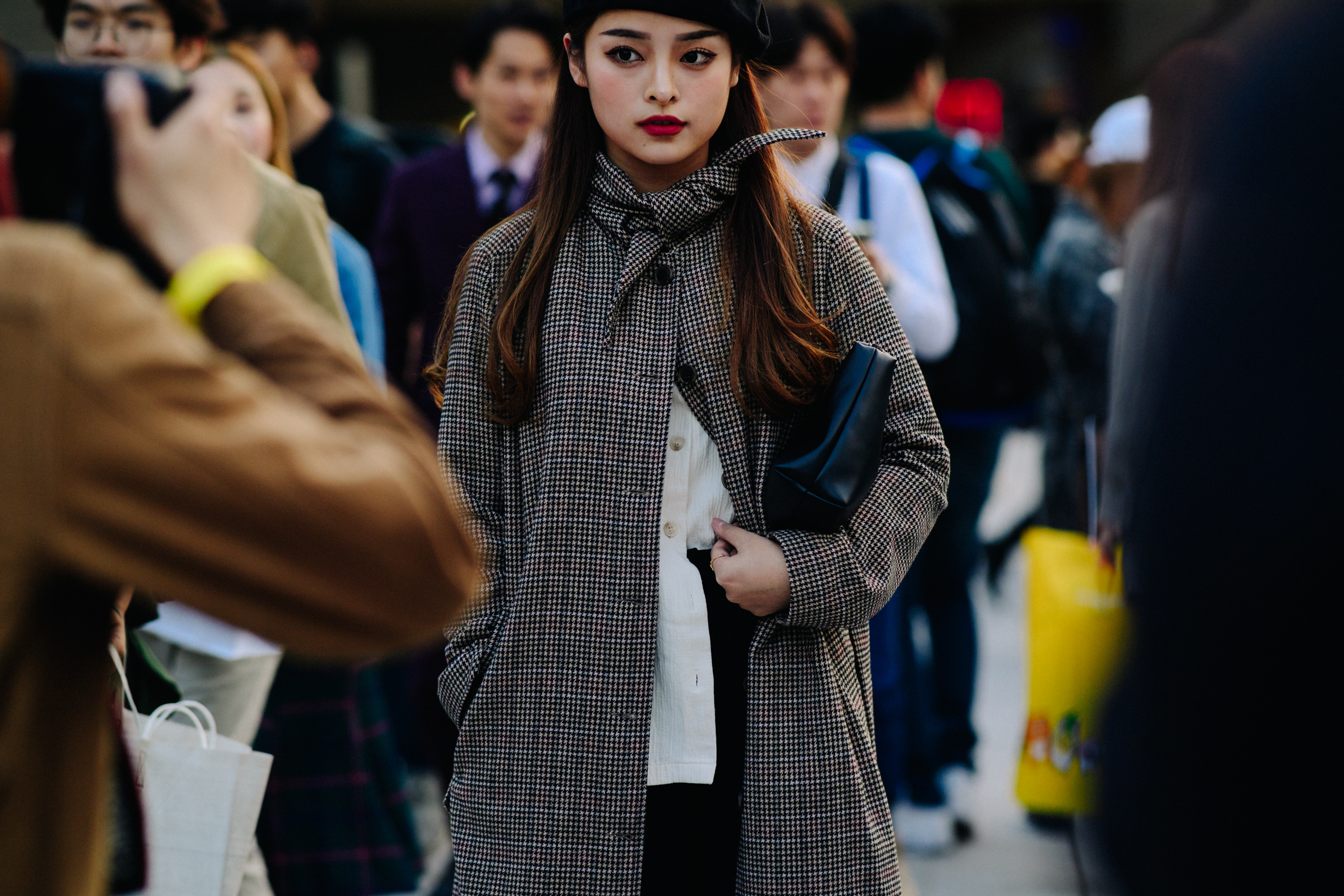 Model in wool coat having portrait taken