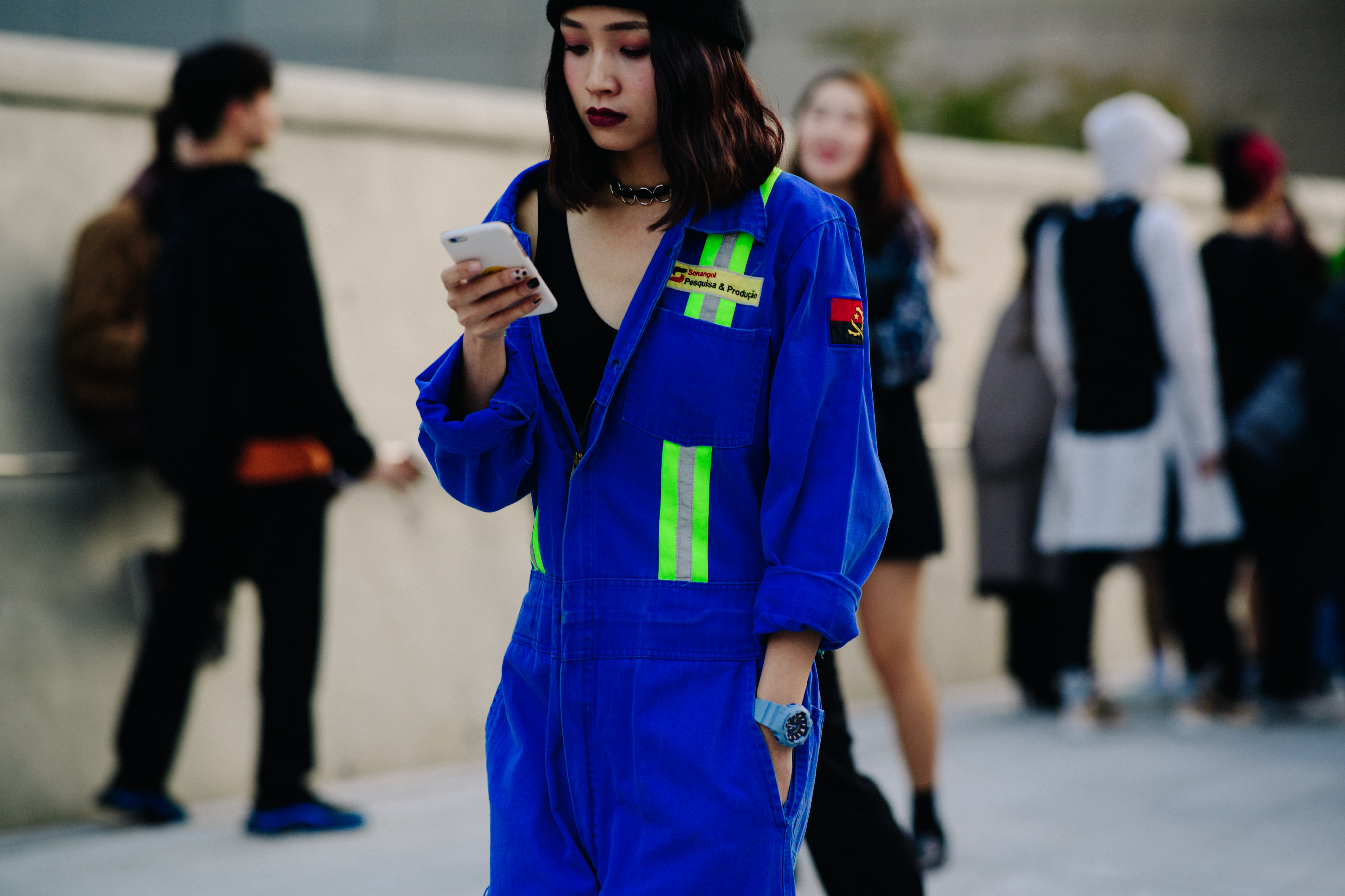 Woman wearing blue and green overalls