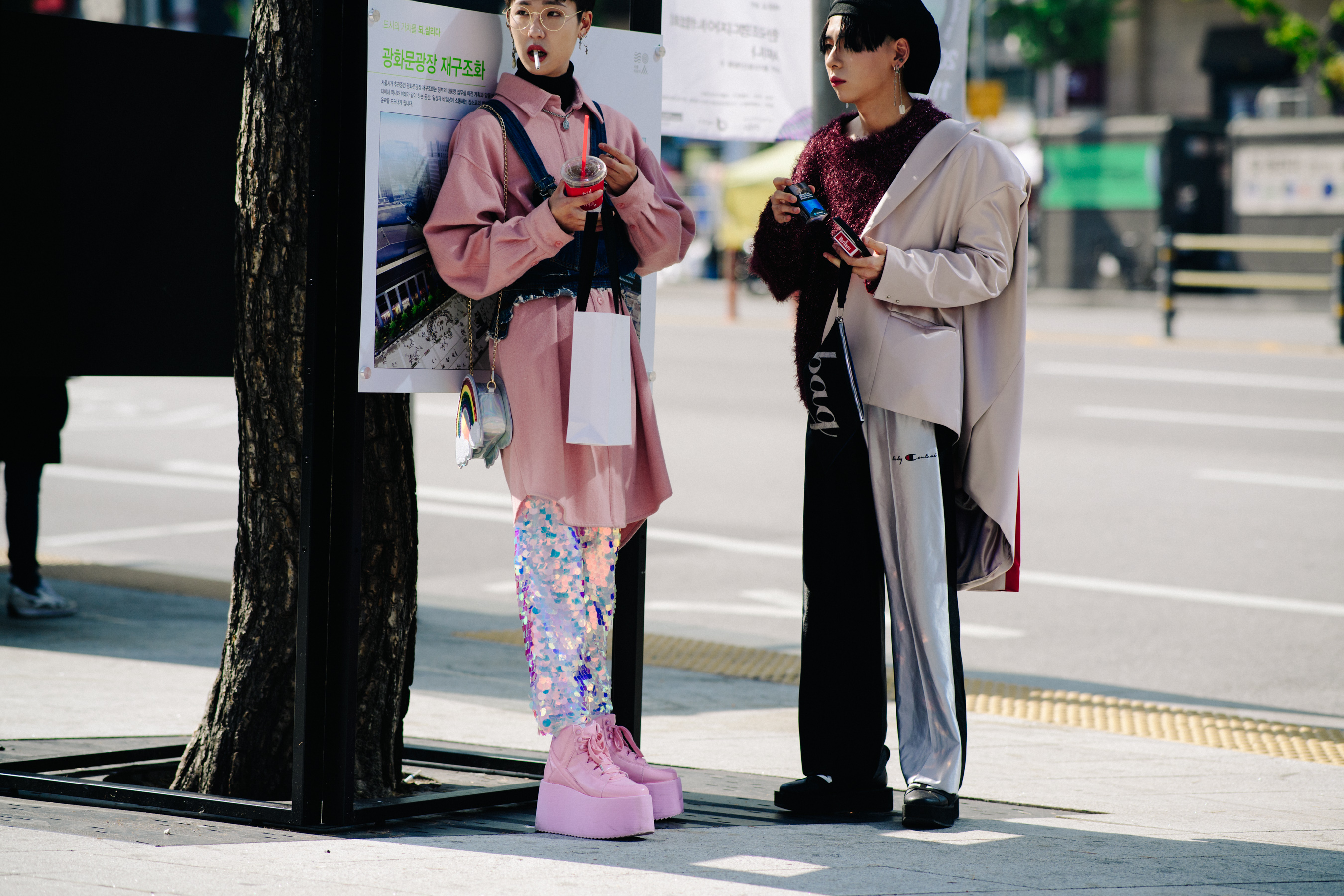 Two women wearing pink and smoking