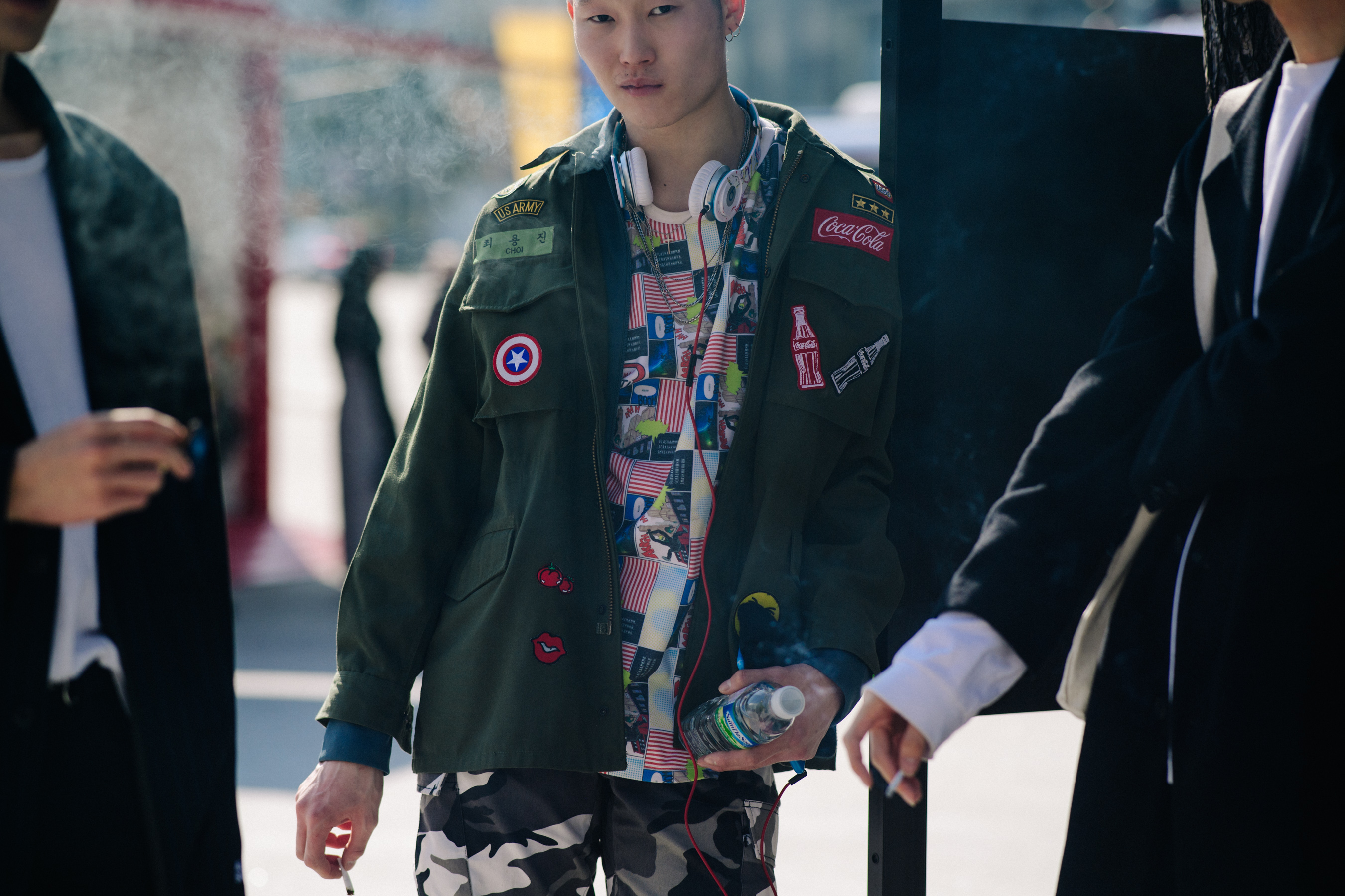 Man wearing patched army shirt