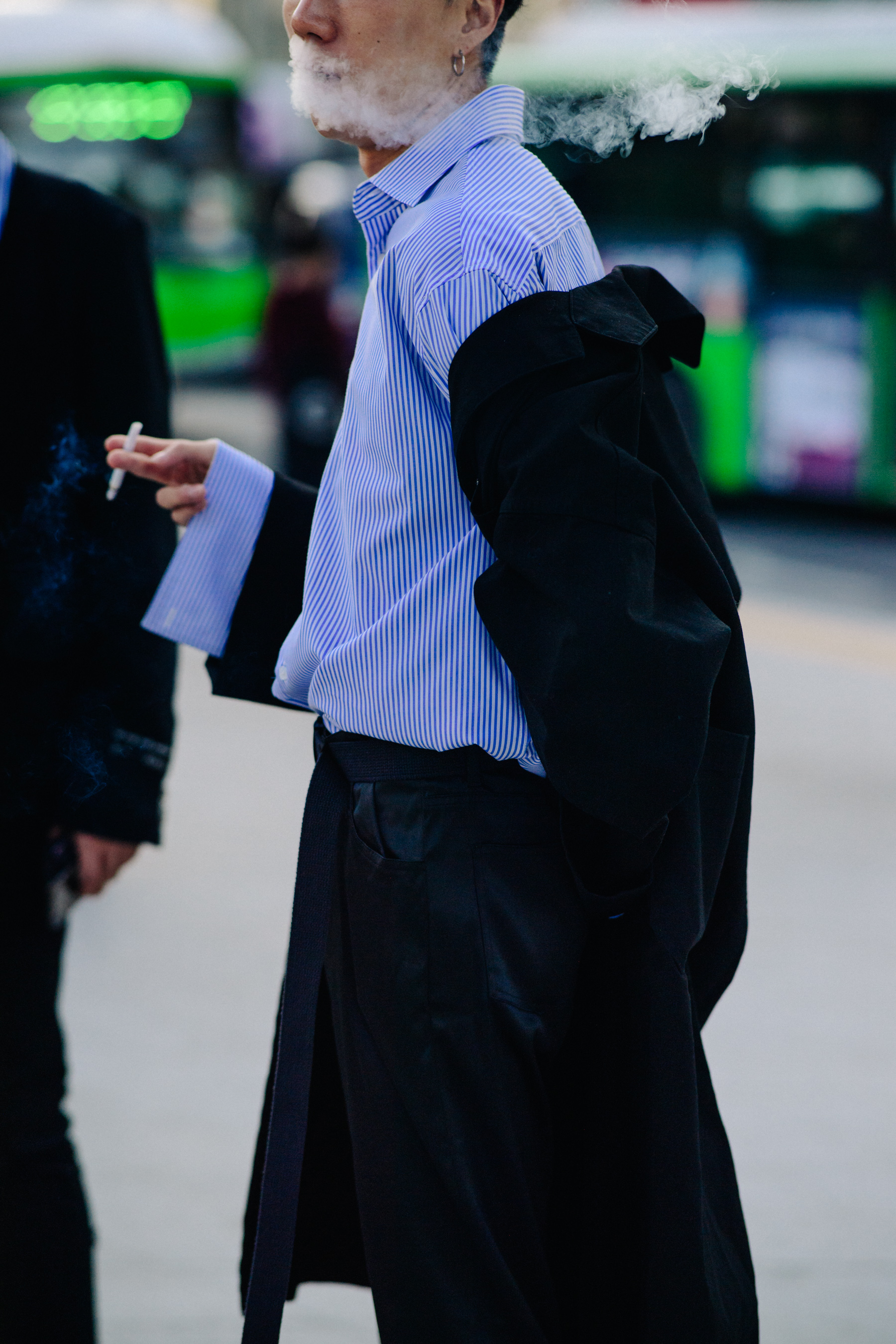 Man wearing blue striped shirt