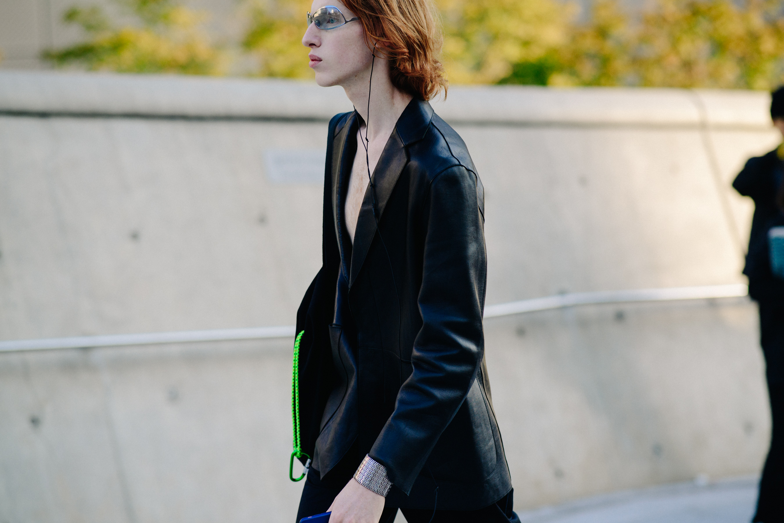 Man walking with silver sunglasses and leather jacket
