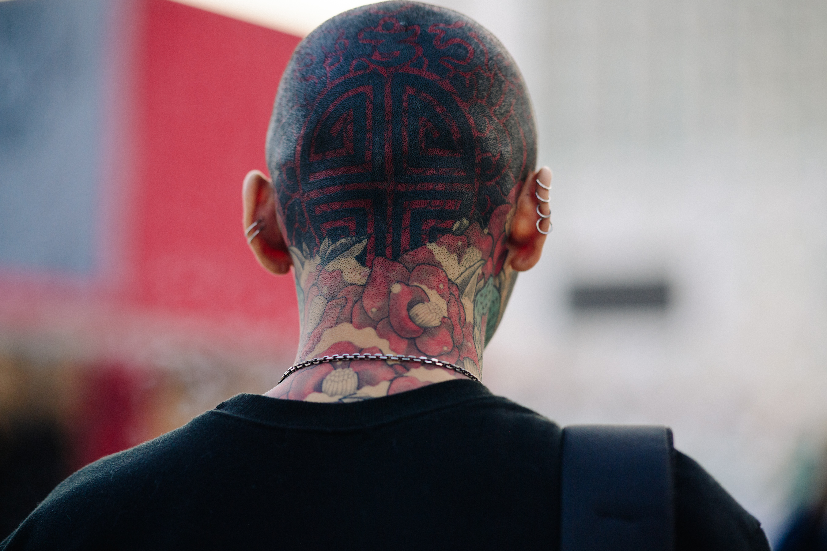 Back of mans head with tattoos