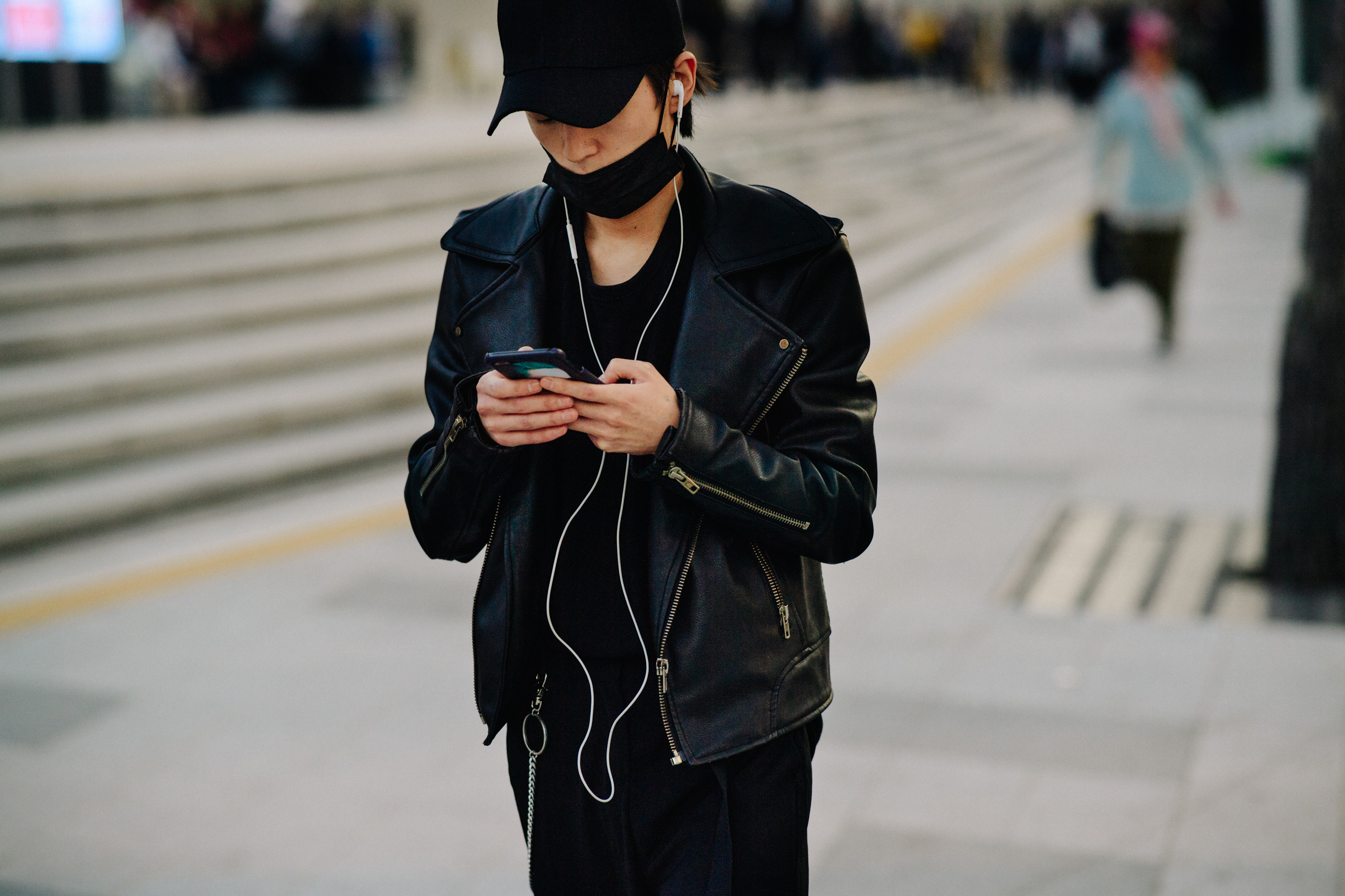 Man wearing leather jacket with gold hardware