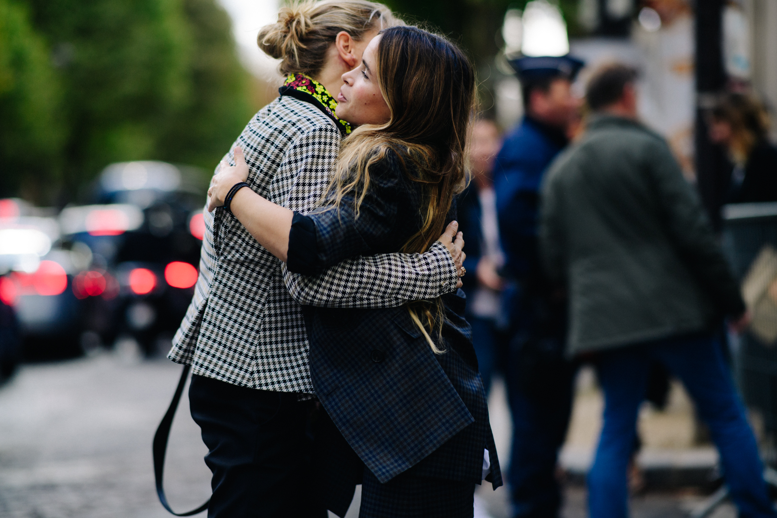 Two women hugging before a show