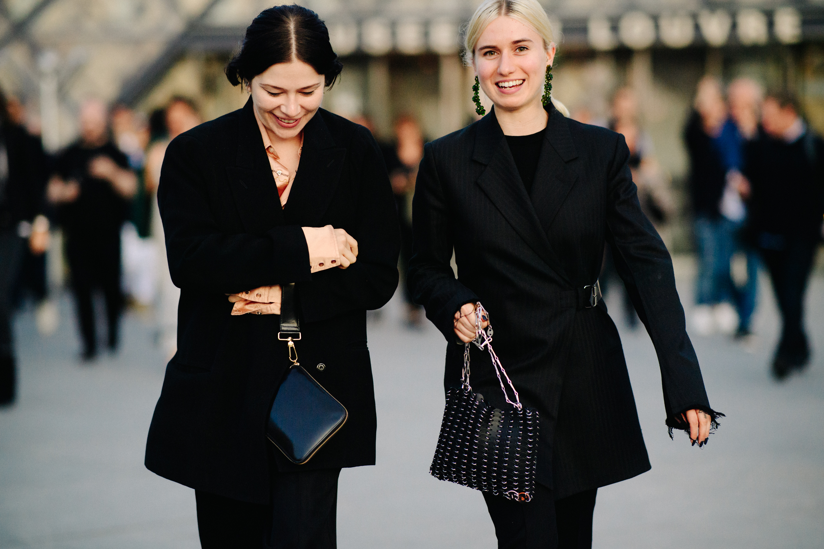 Two British editors wearing black blazers