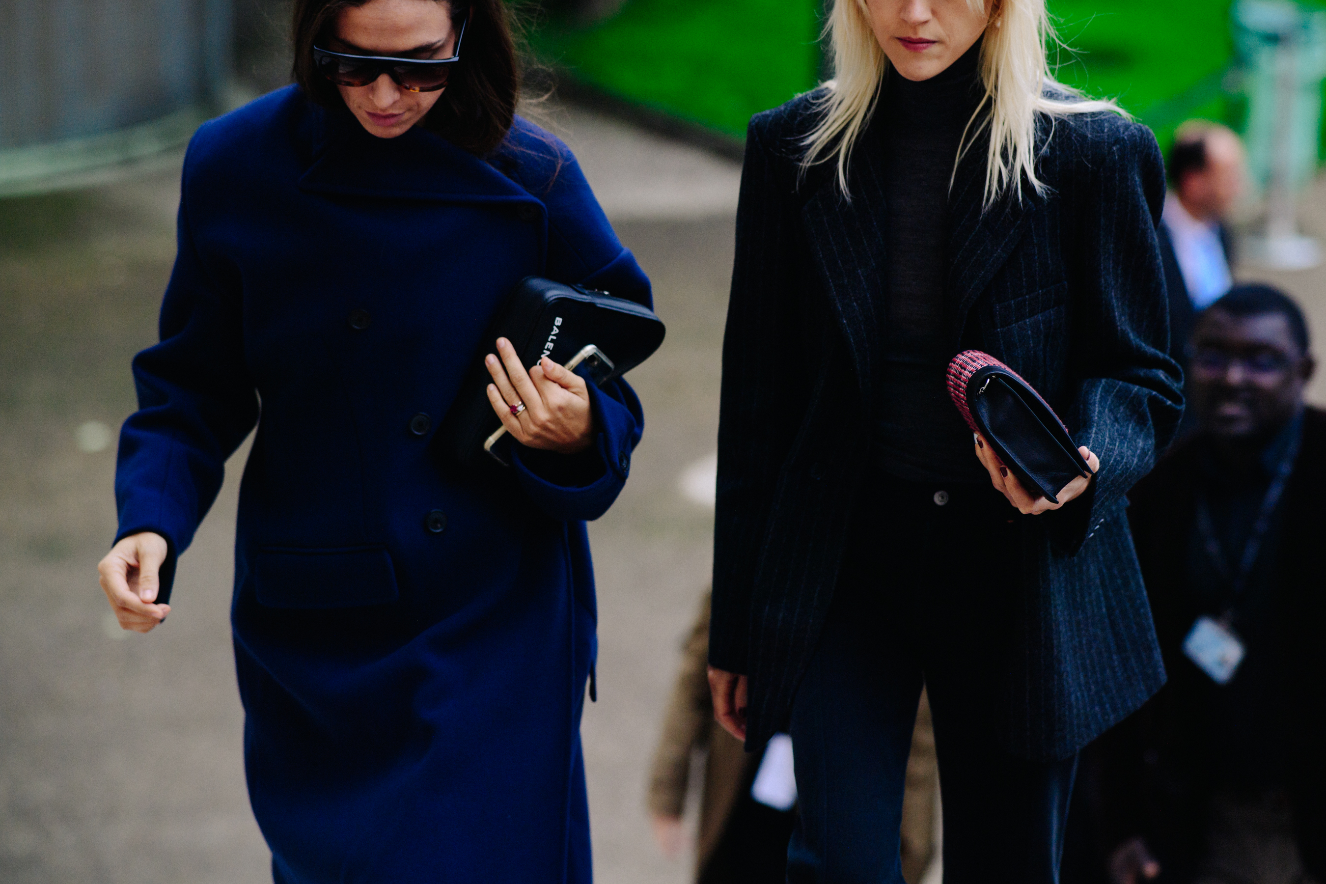 Two women wearing dark clothes