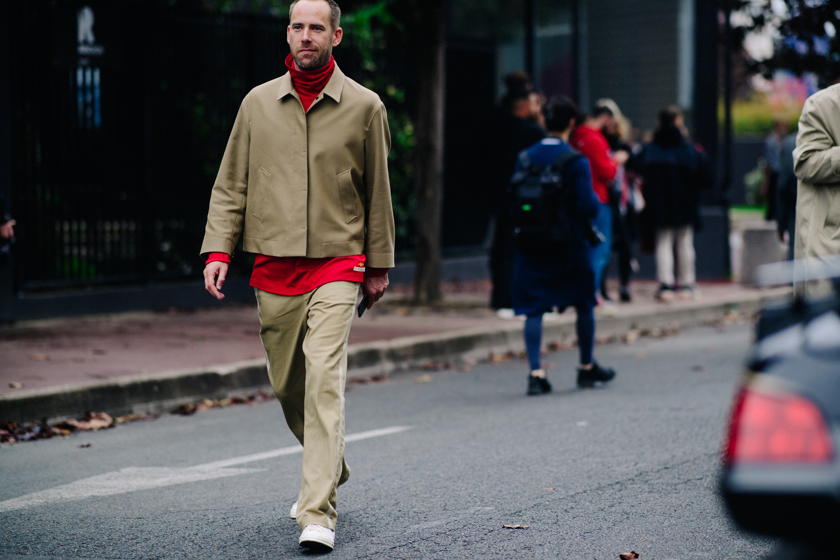 Editor wearing beige suit
