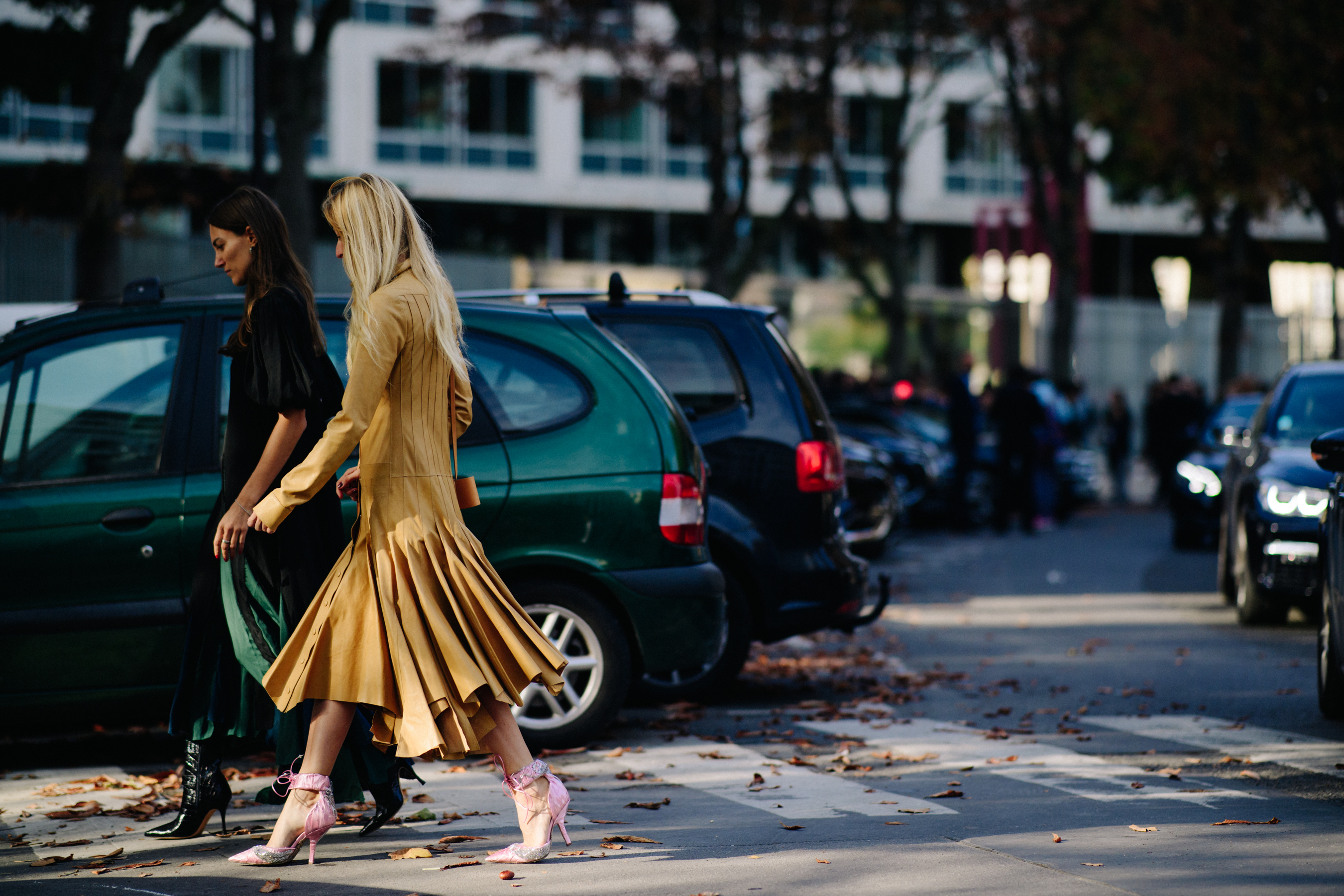 Italian designer wearing brown dress