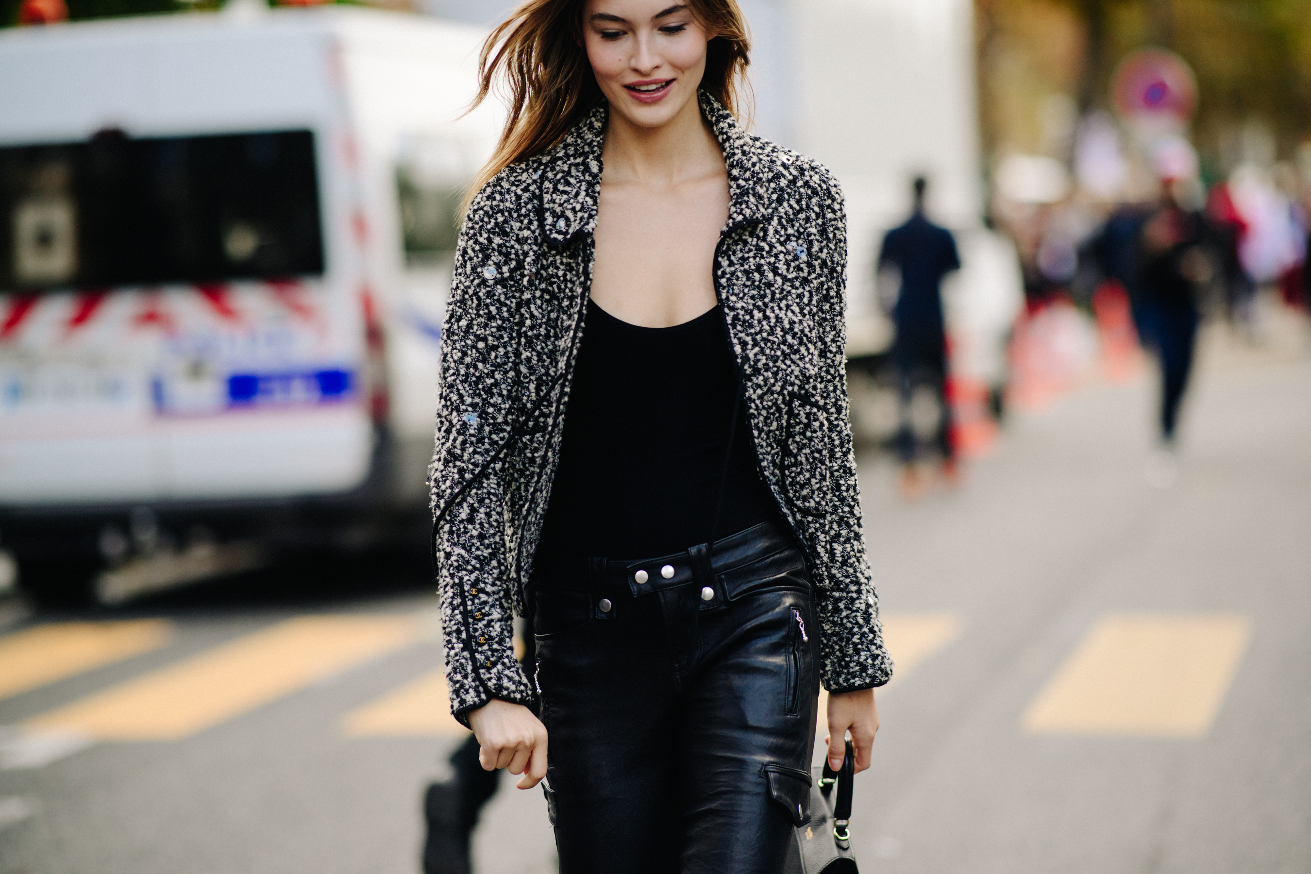 Model wearing leather pants after a show