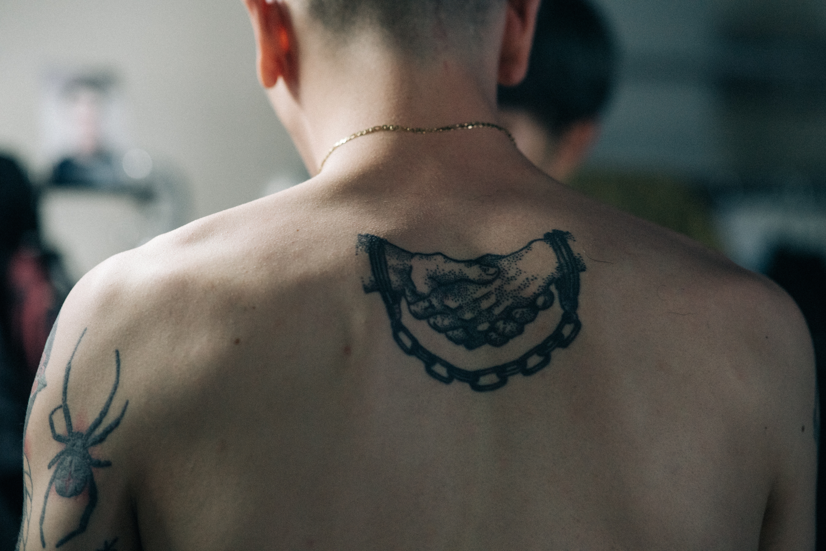 Detail of back tattoo on model