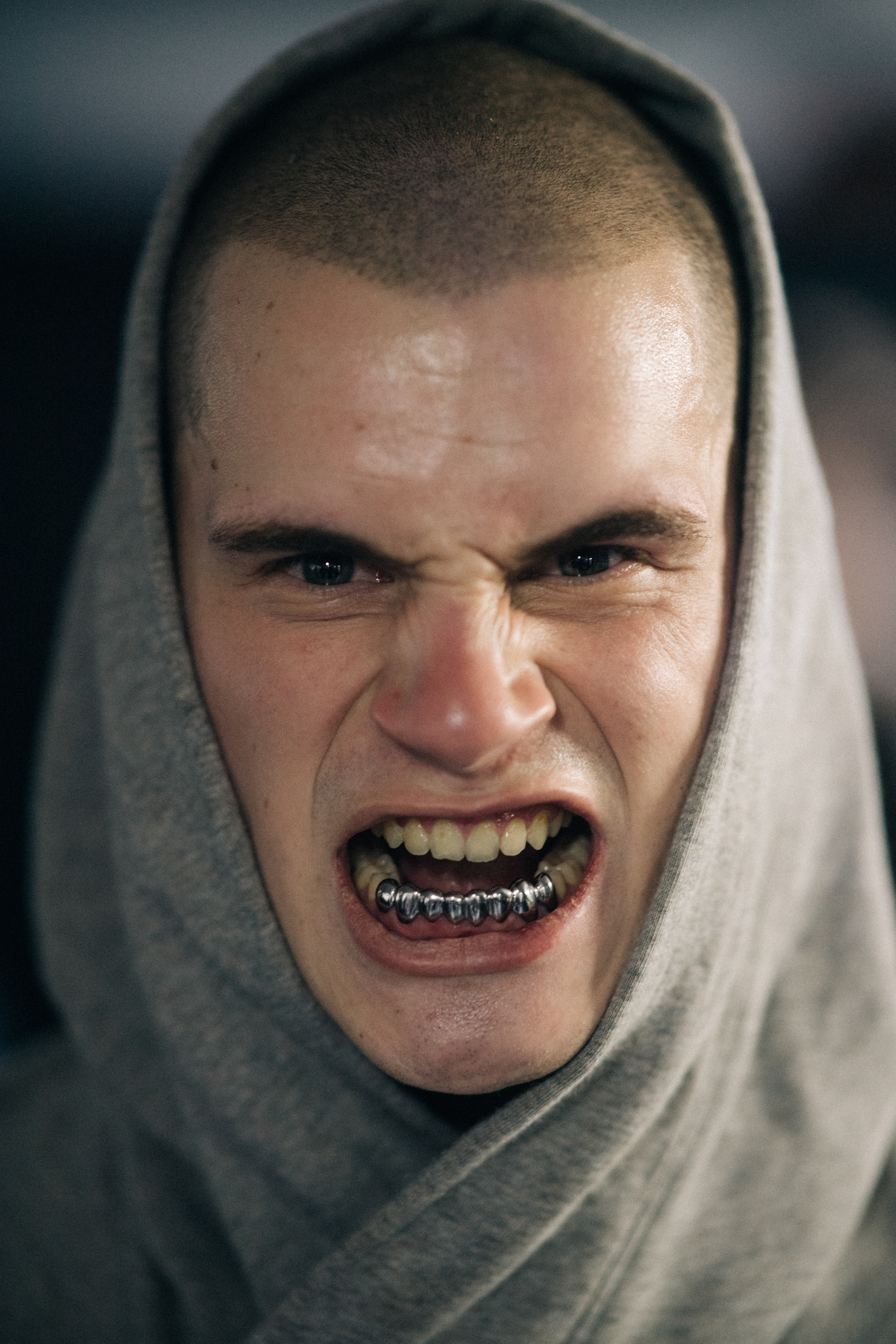 Portrait of model backstage with silver teeth