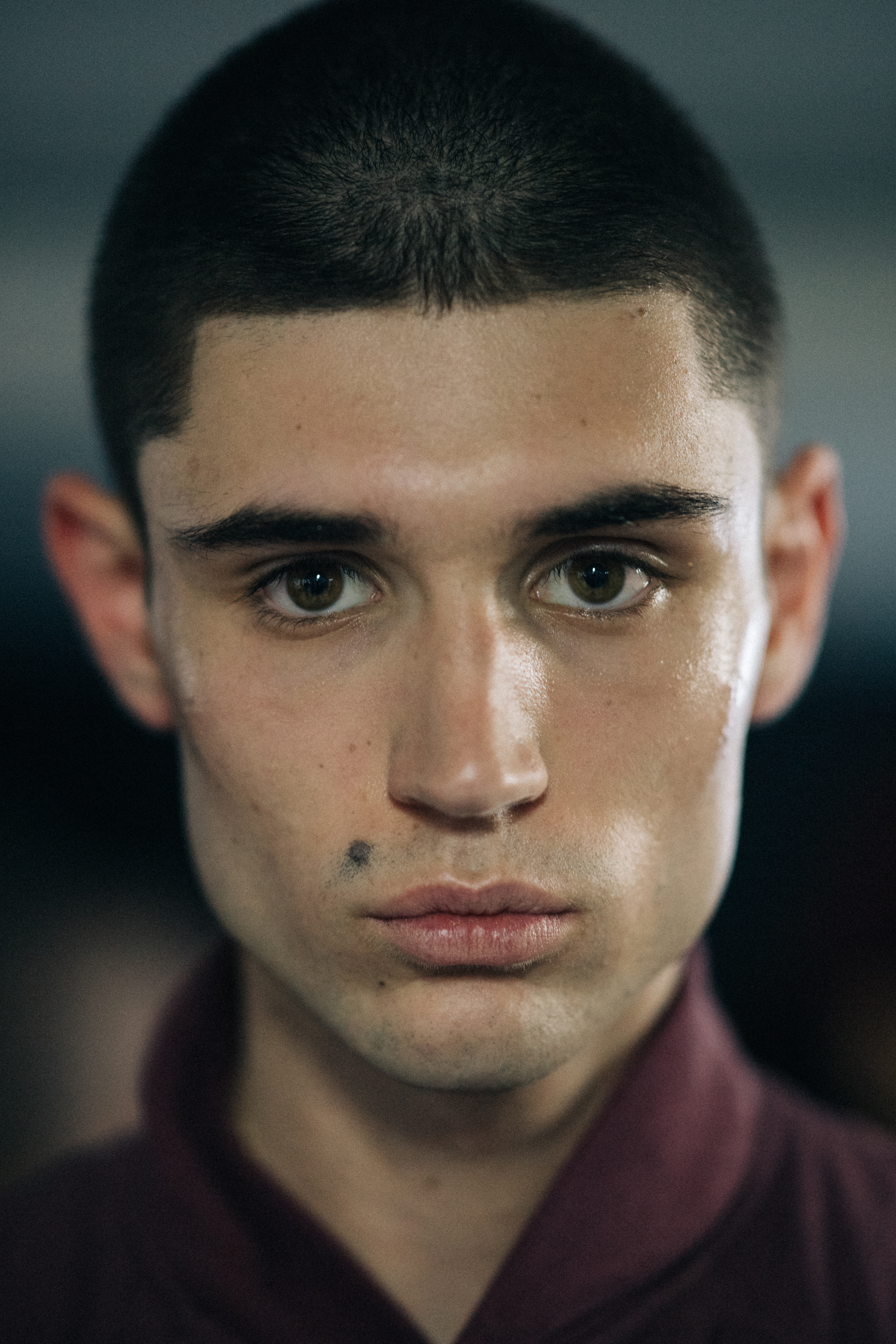 Portrait of model with dark shaved hair
