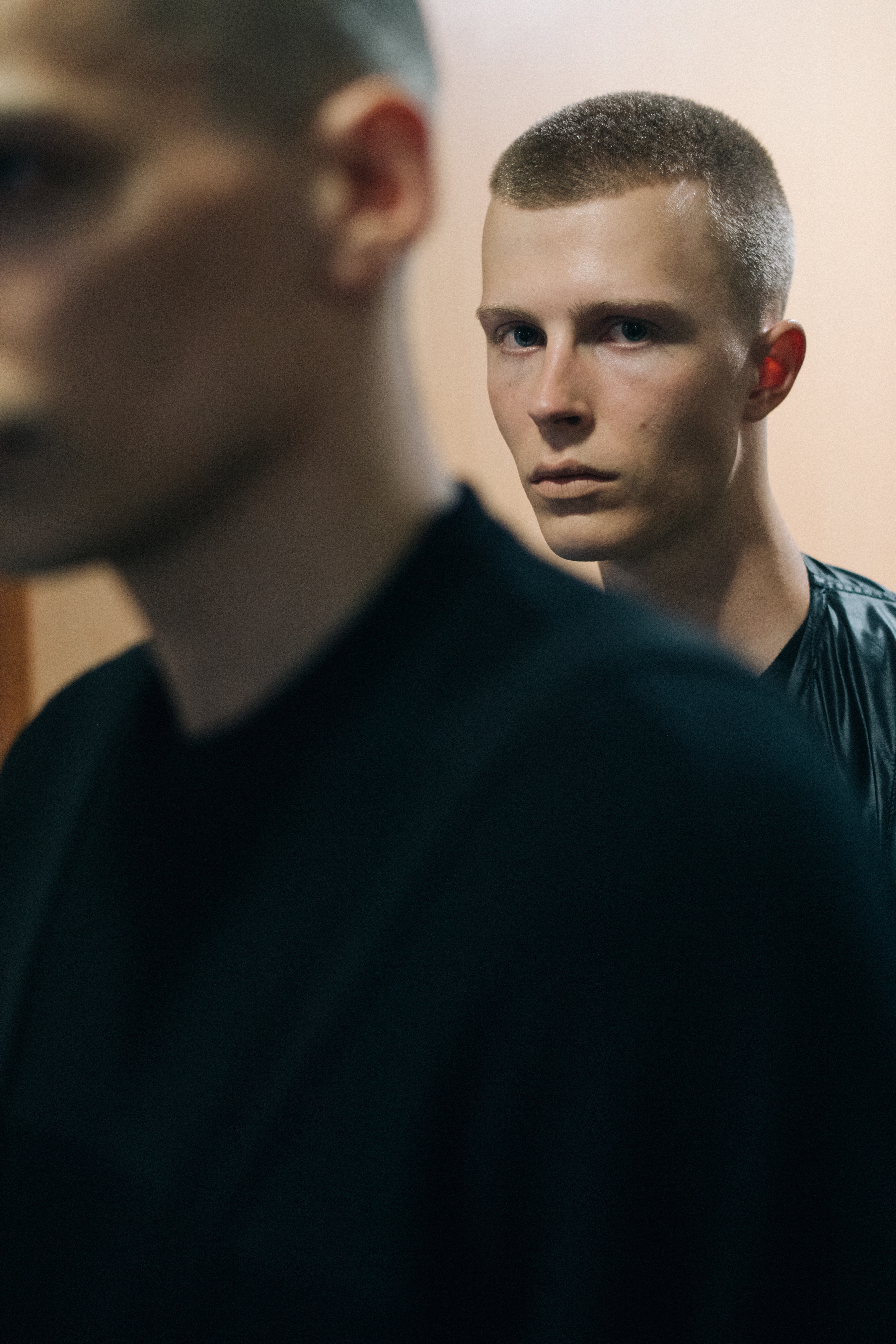 Model looking over models shoulder