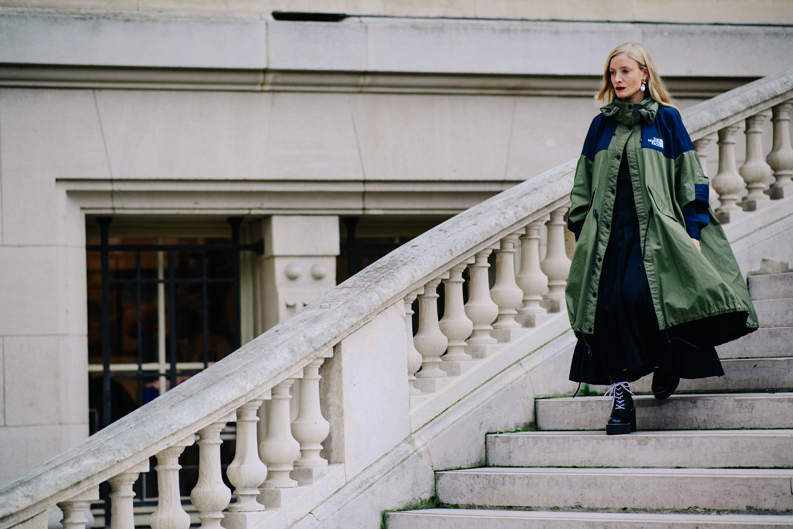 Woman wearing The North Face x Sacai parka
