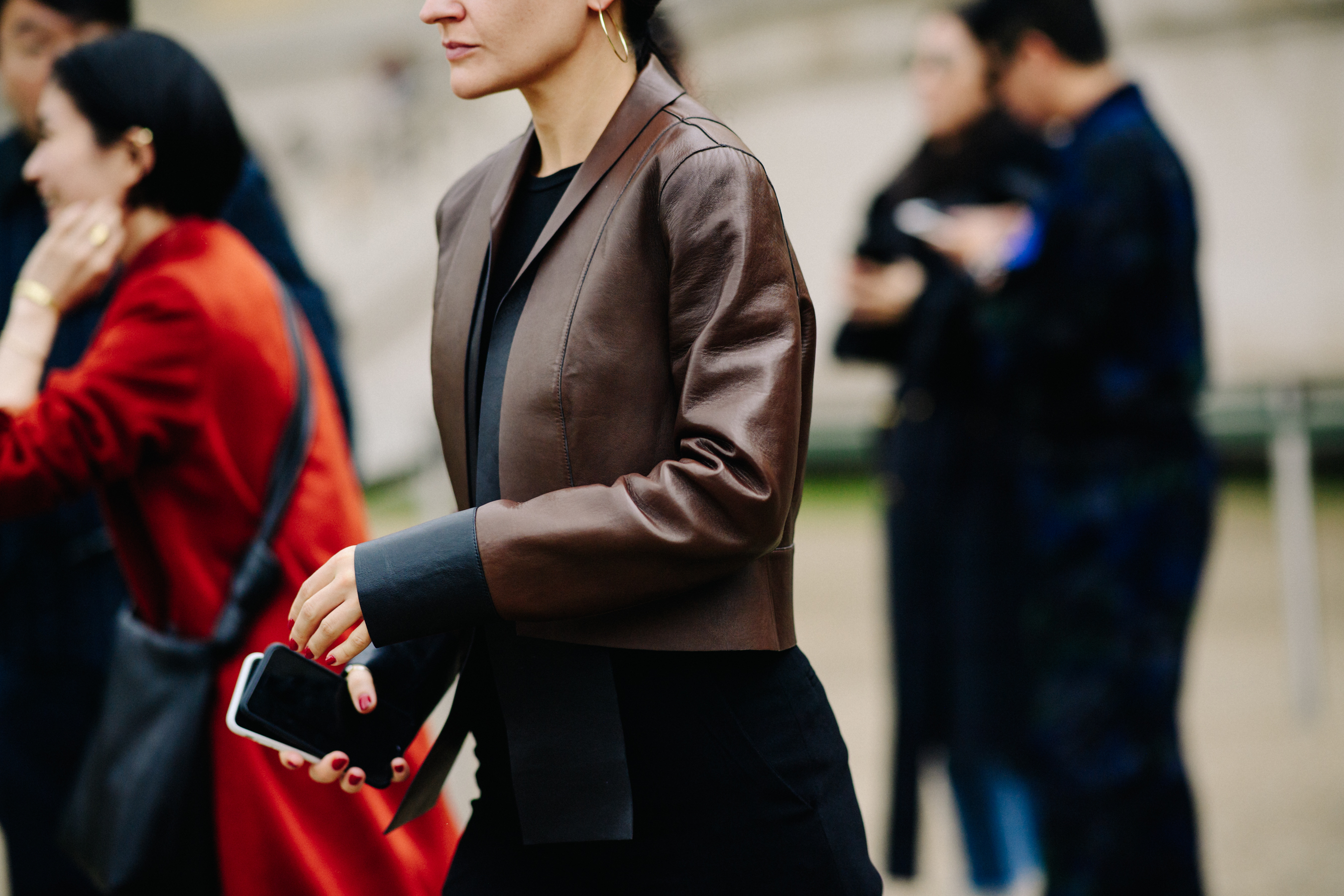 Woman wearing brown leather jacket