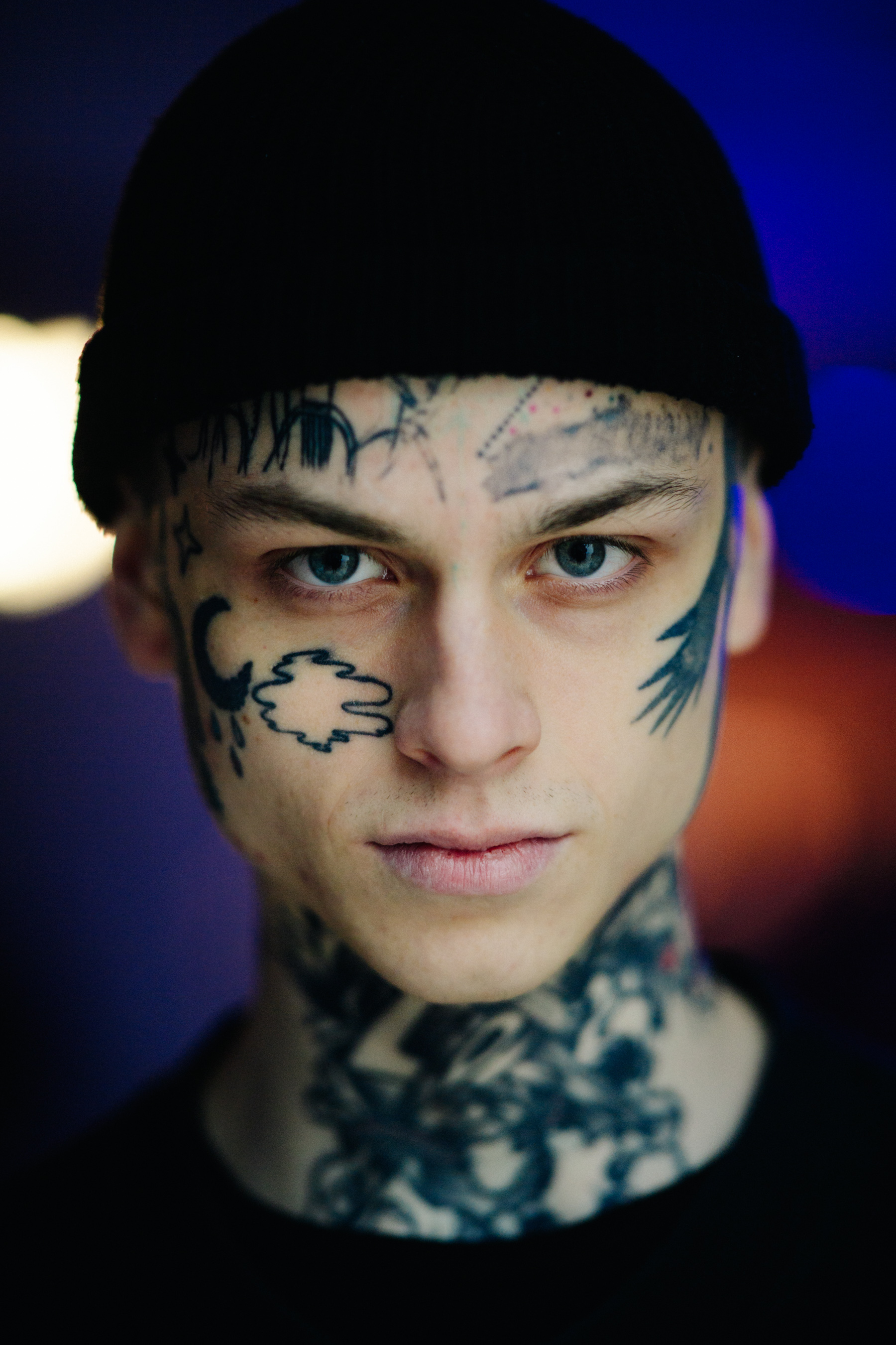 Portrait of man with face tattoos
