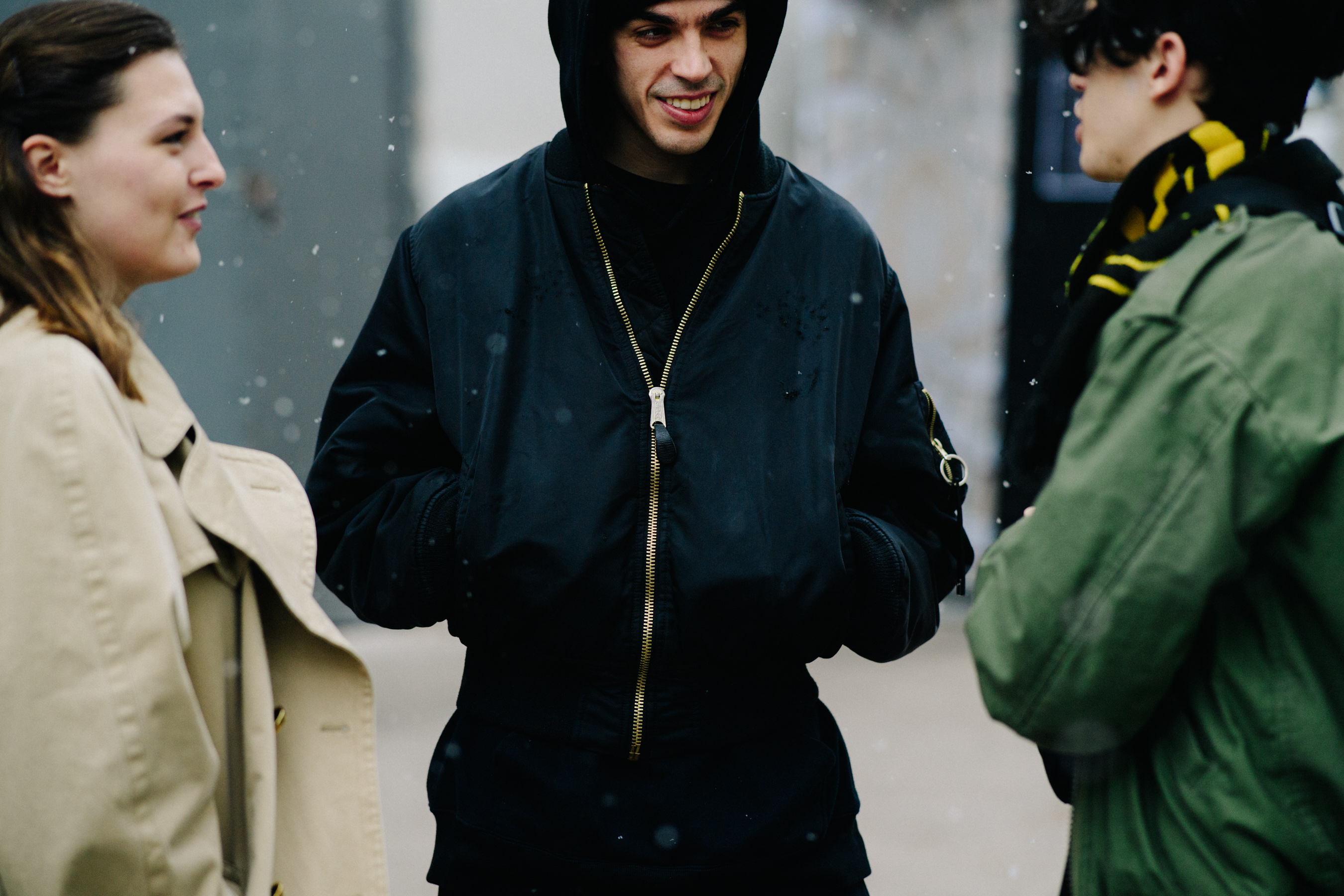 Man wearing balck bomber jacket