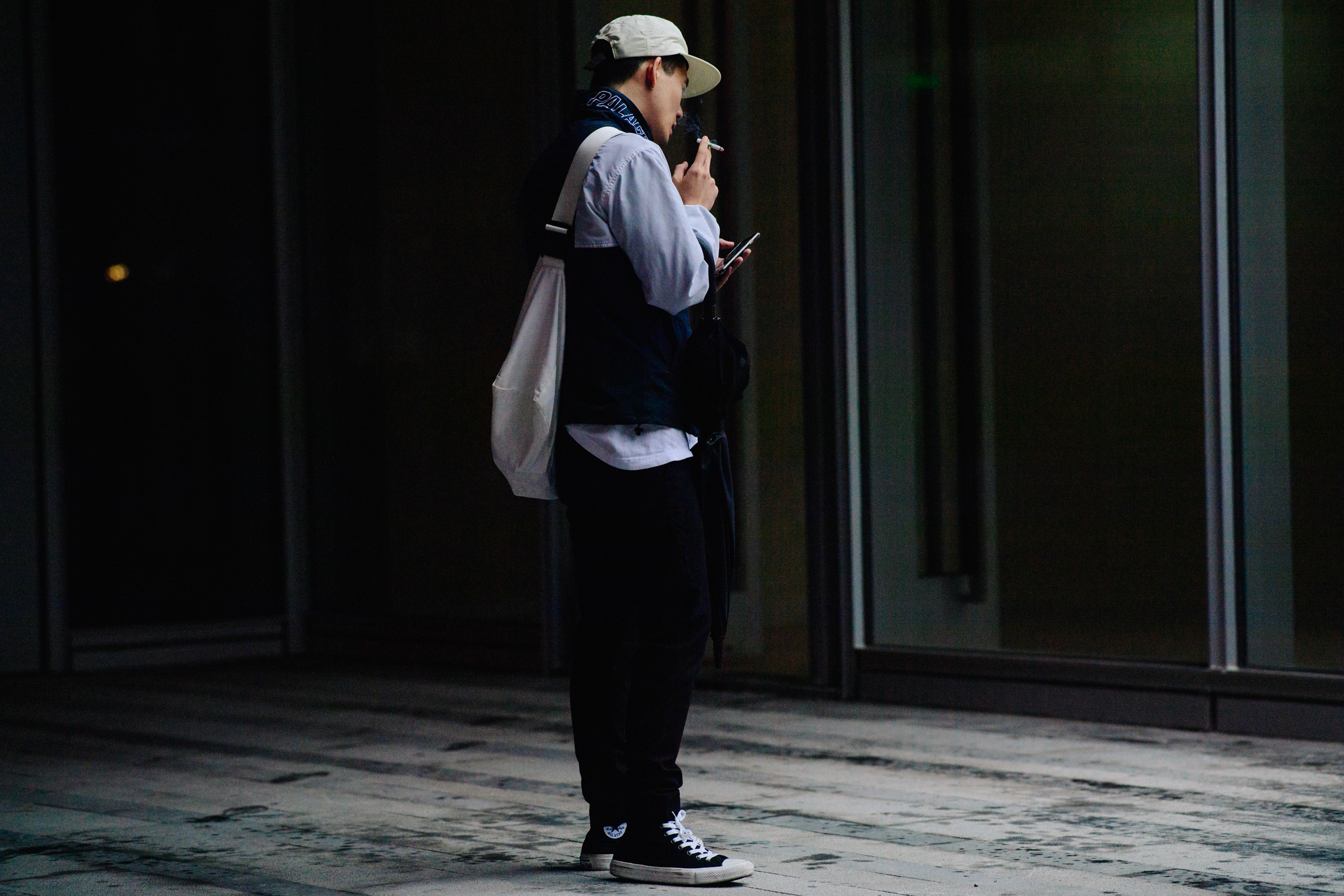 Man smoking in Palace jacket