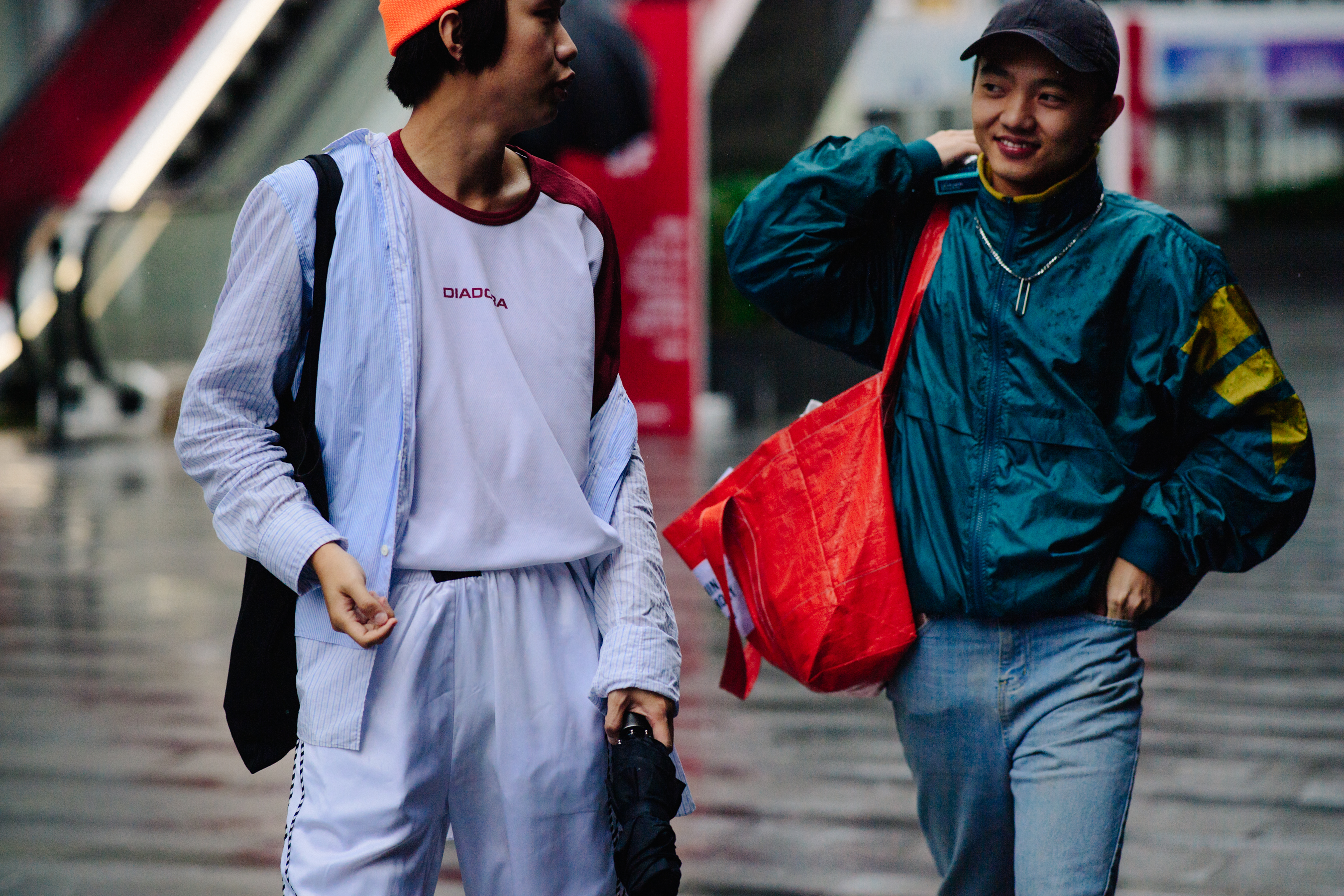 Two men wearing sportswear in the rain
