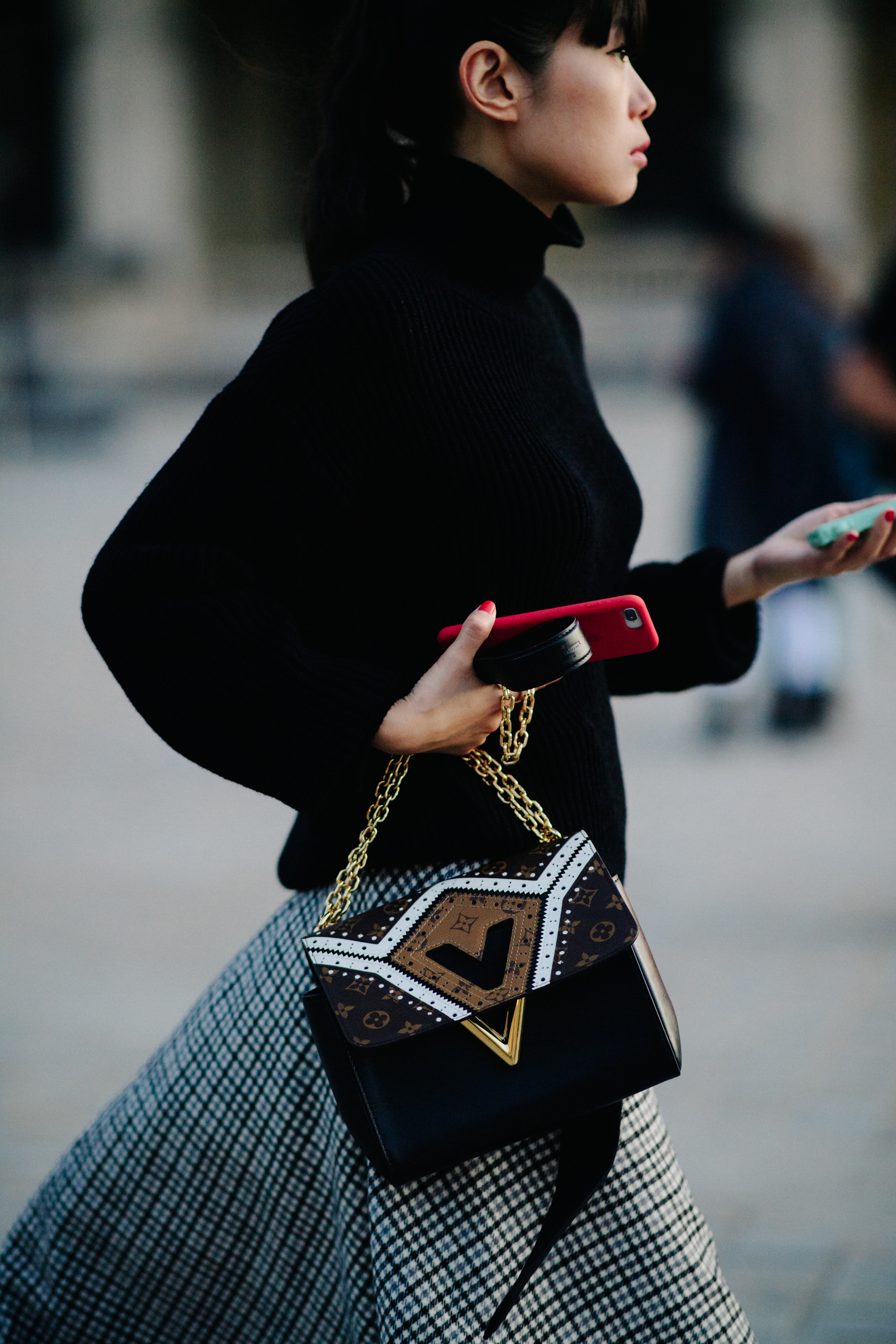 Woman wearing Louis Vuitton bag