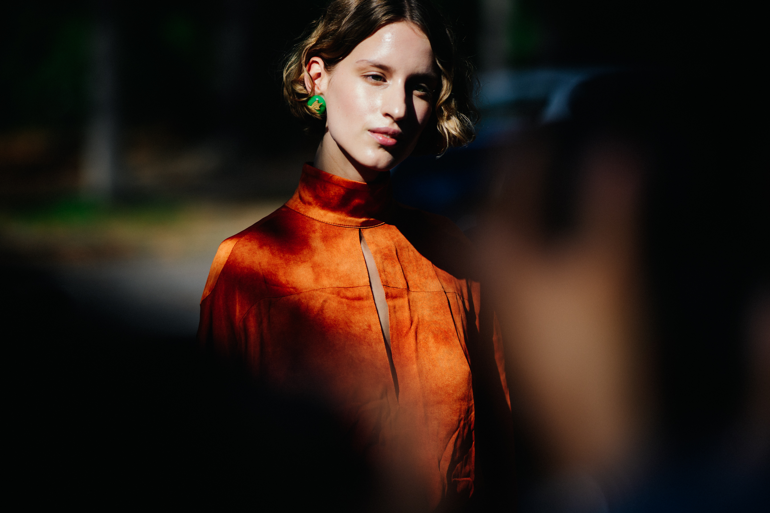 Woman wearing orange velvet dress