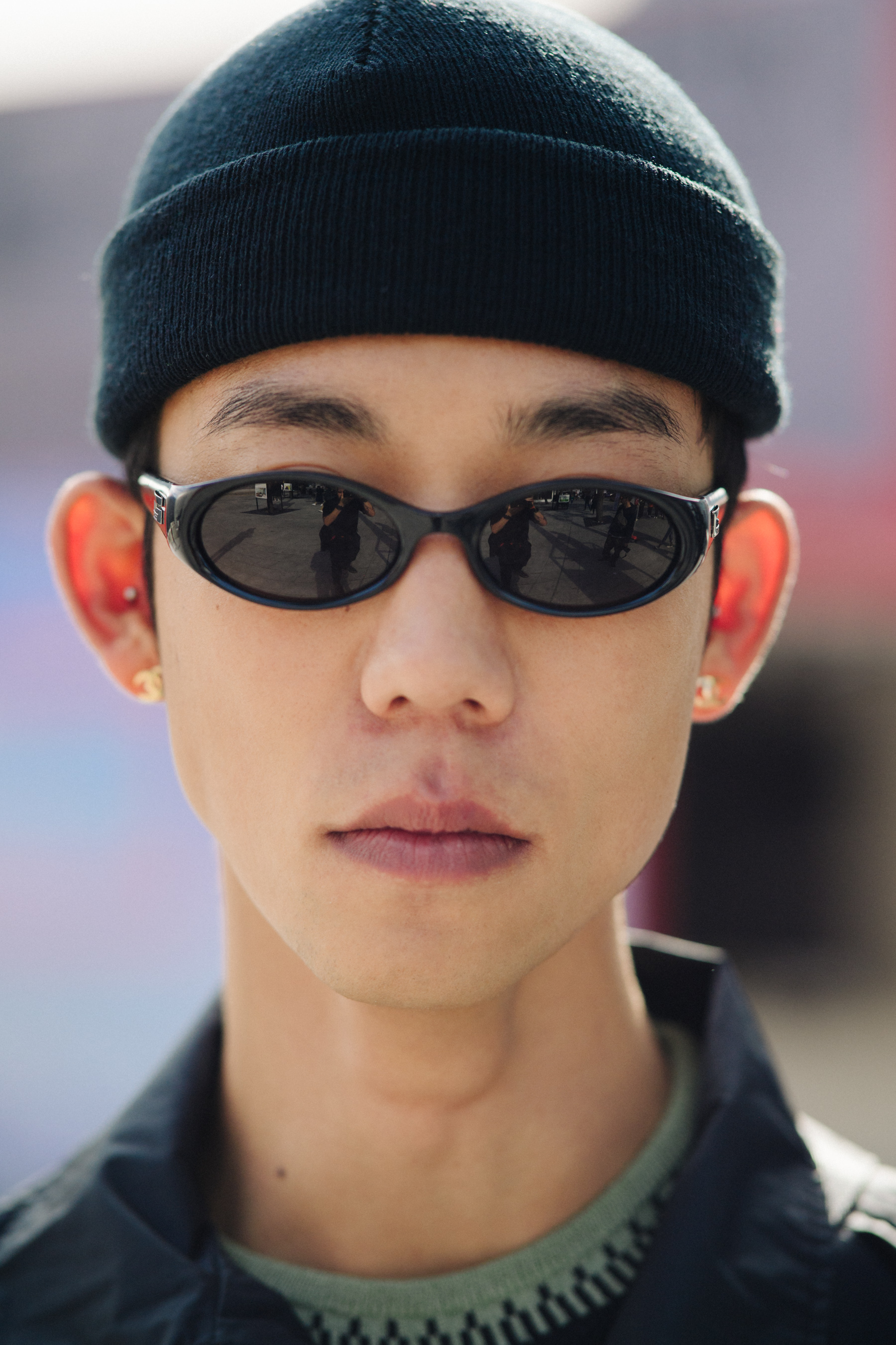 Portrait of Korean model wearing dark sunglasses and beanie