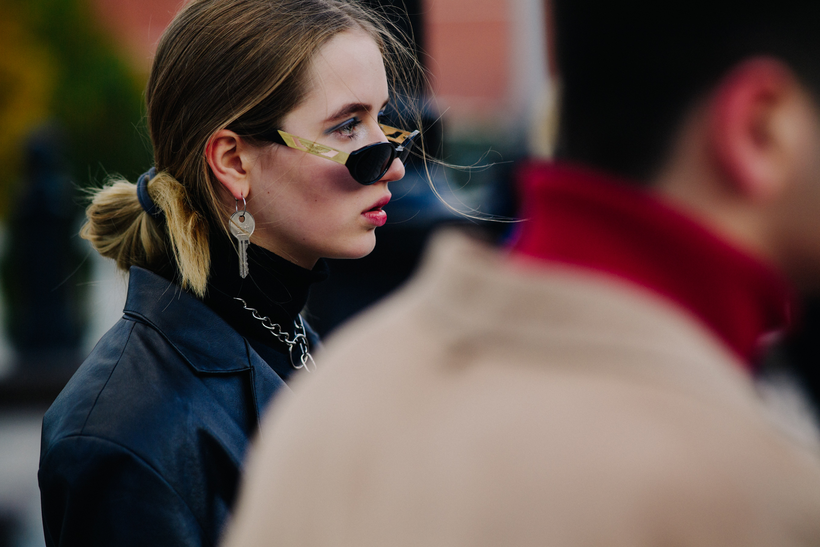 Closeup of woman with key earring