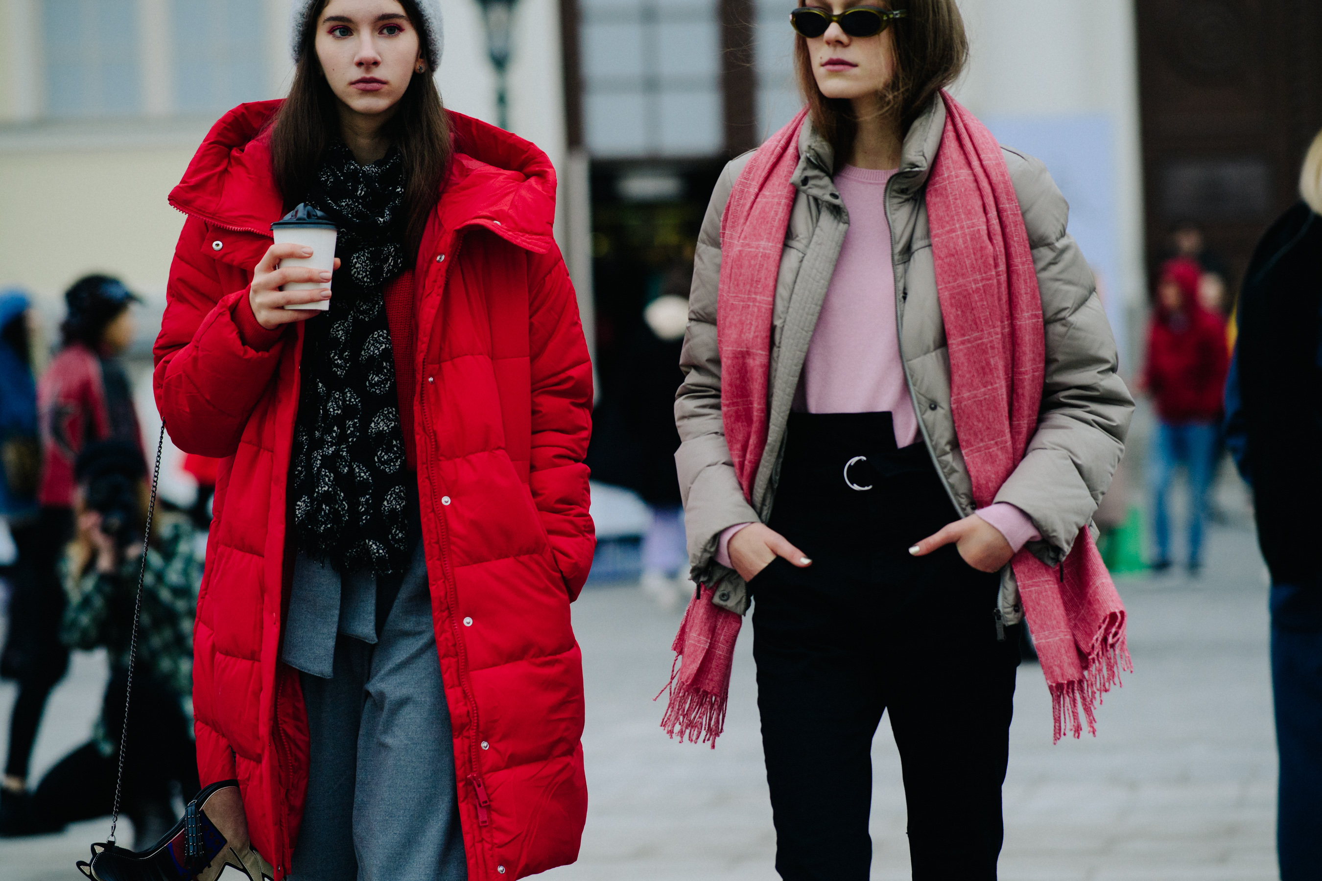 Two women in red and pink winter clothing