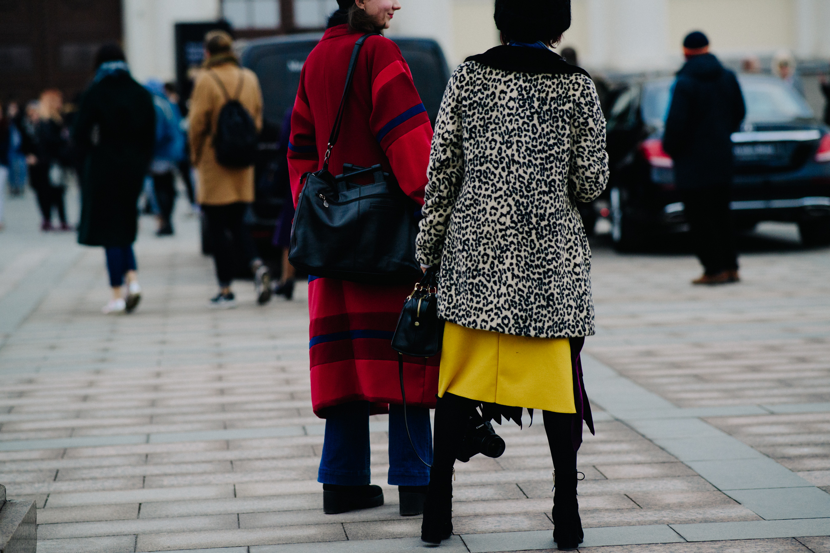 Two women in long thick winter coats