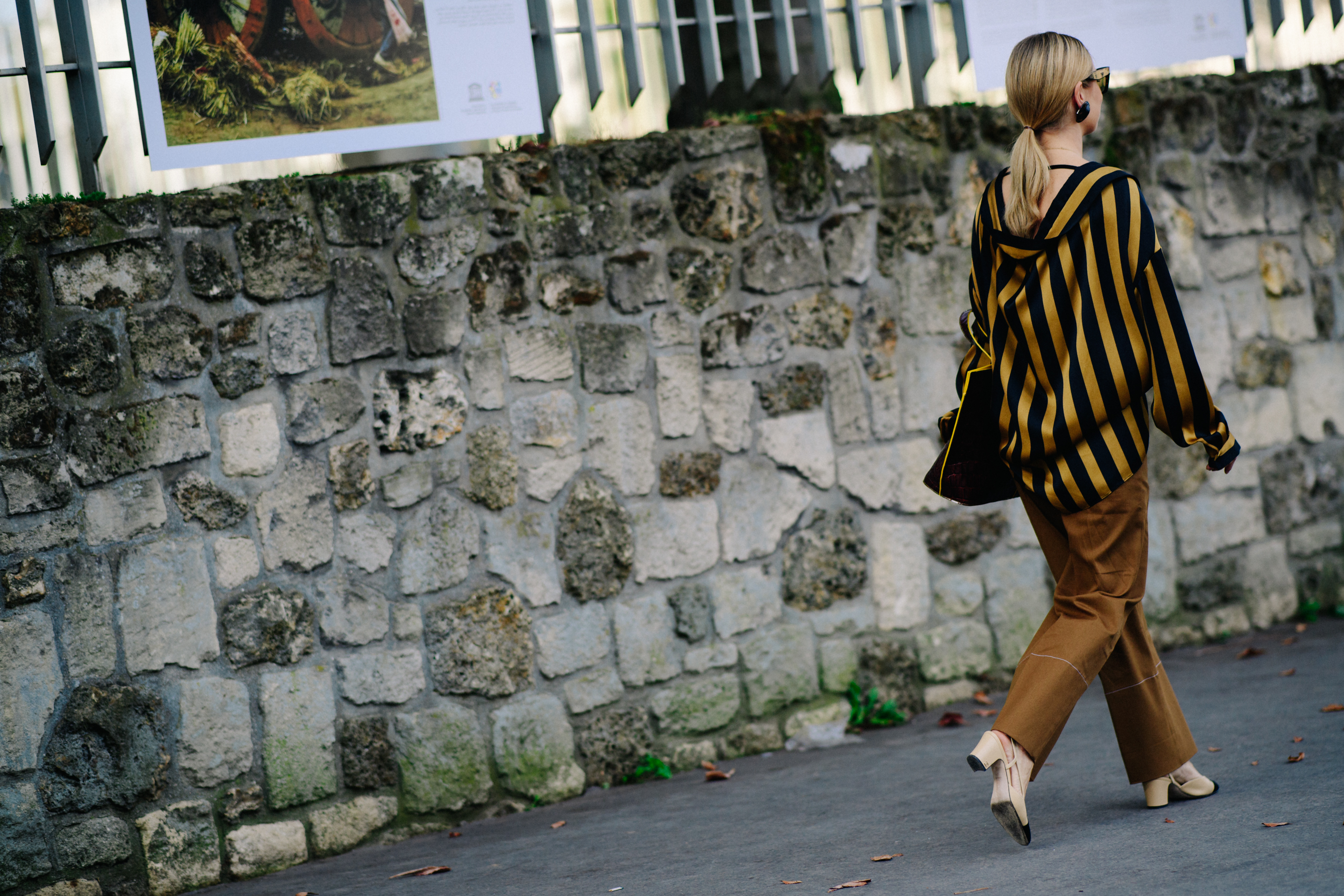 British editor wearing brown outfit