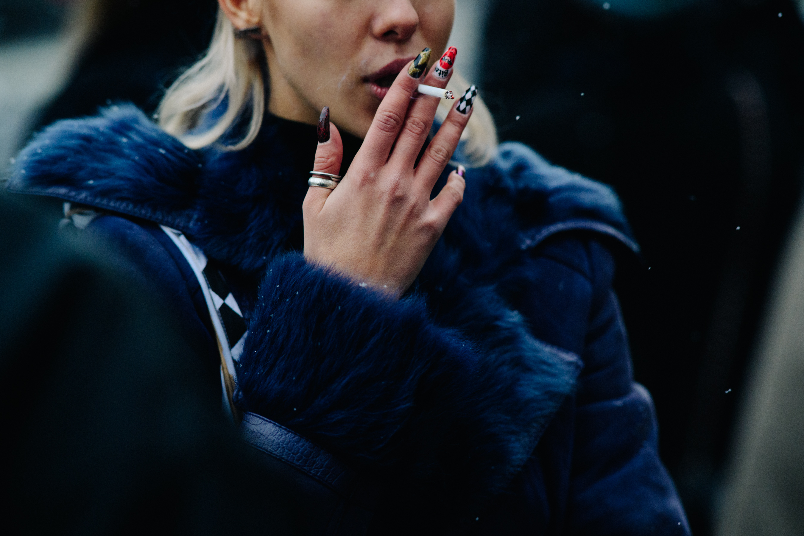Closeup of woman with painted nails