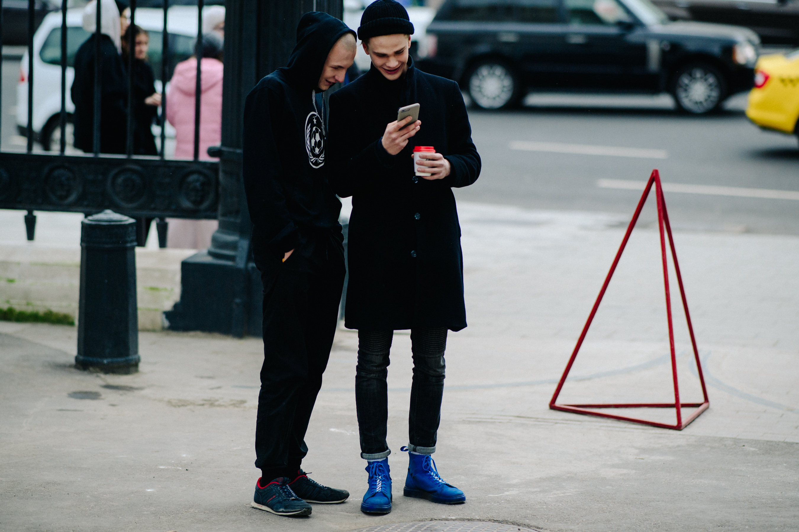 Two men wearing black outfits