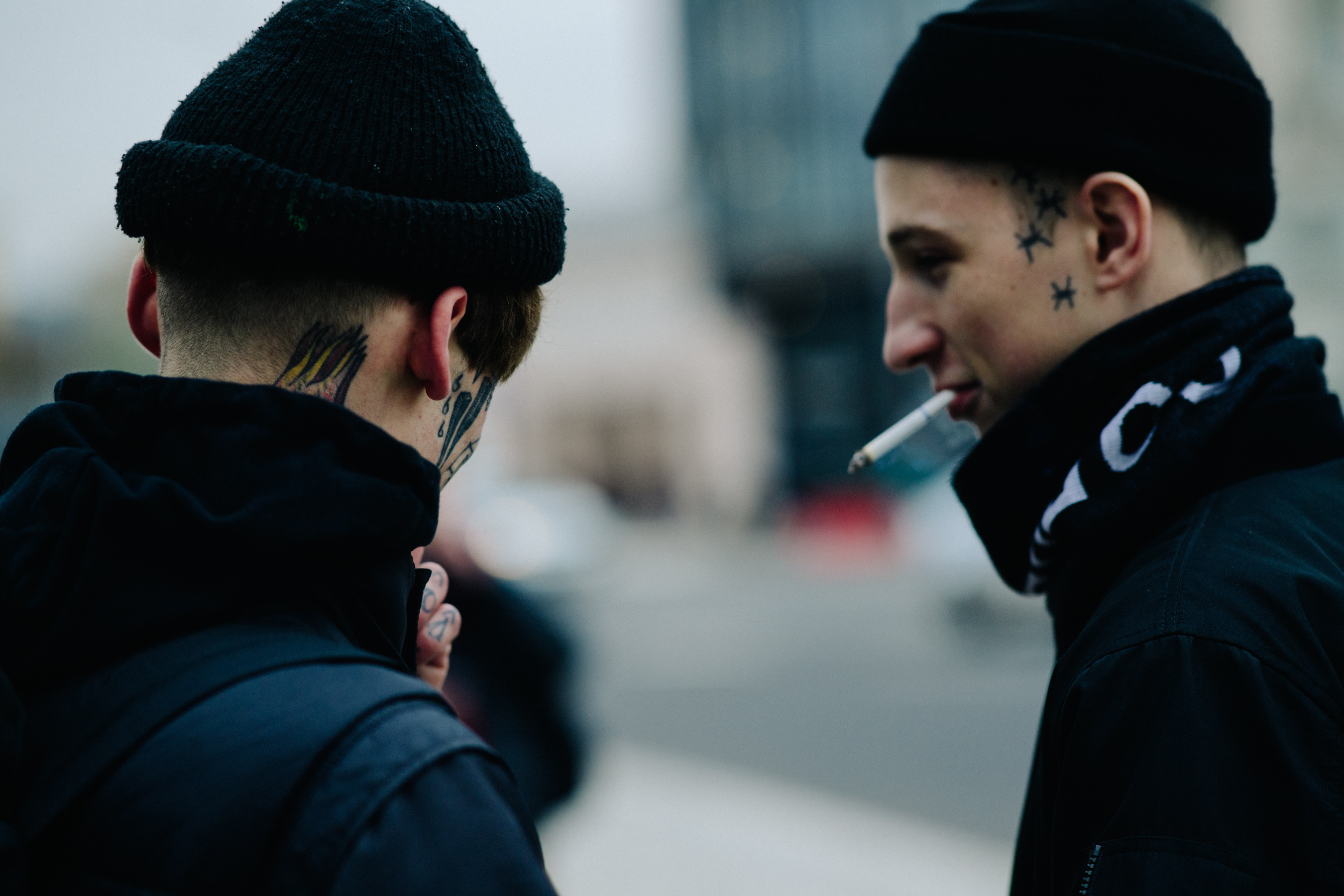 Two men with face tattoos