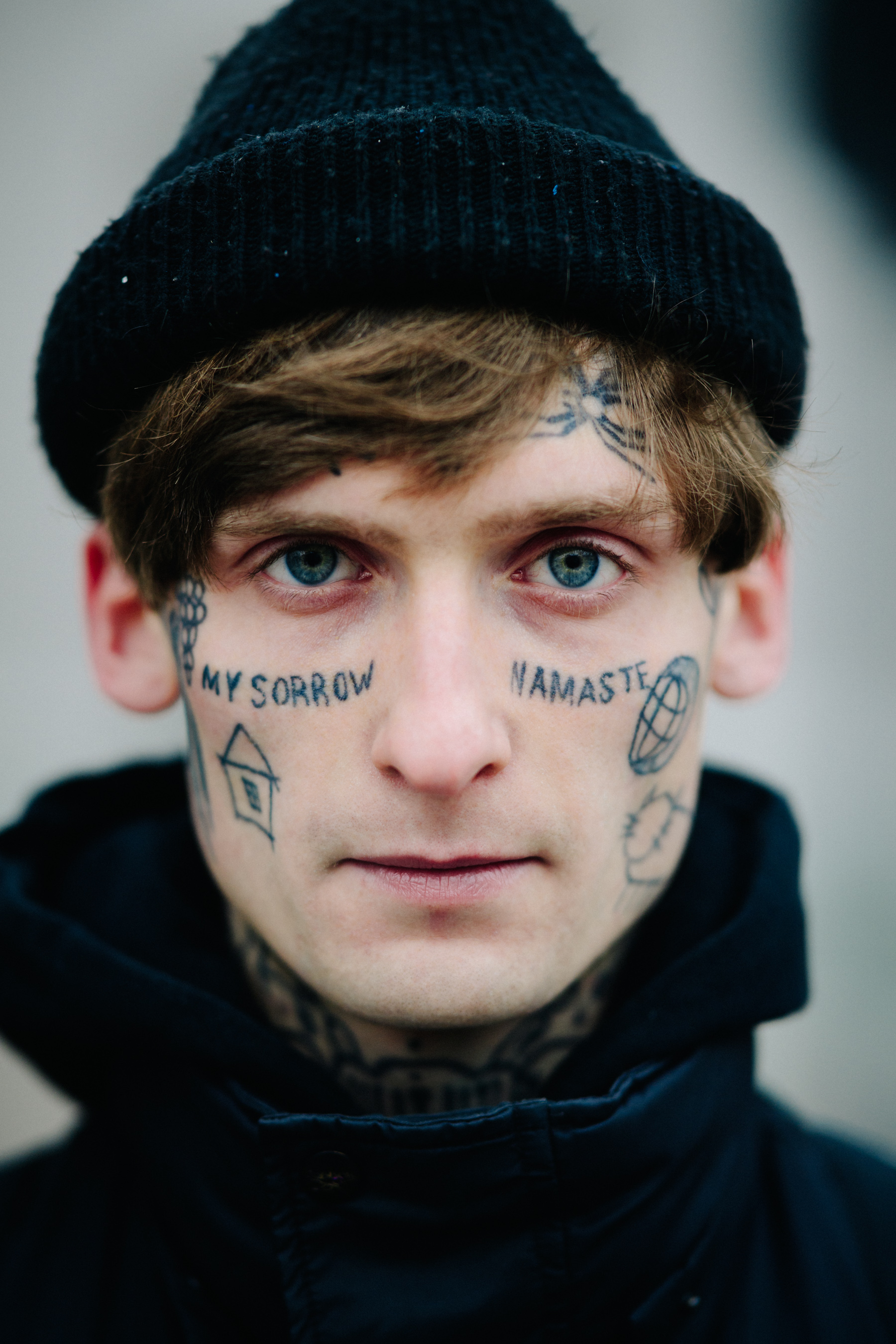Portrait of man with face tattoos