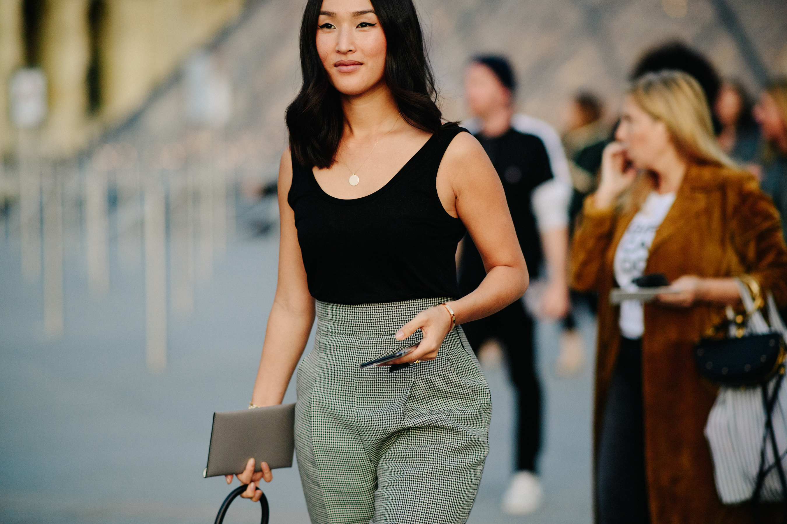 Blogger wearing black top and trousers