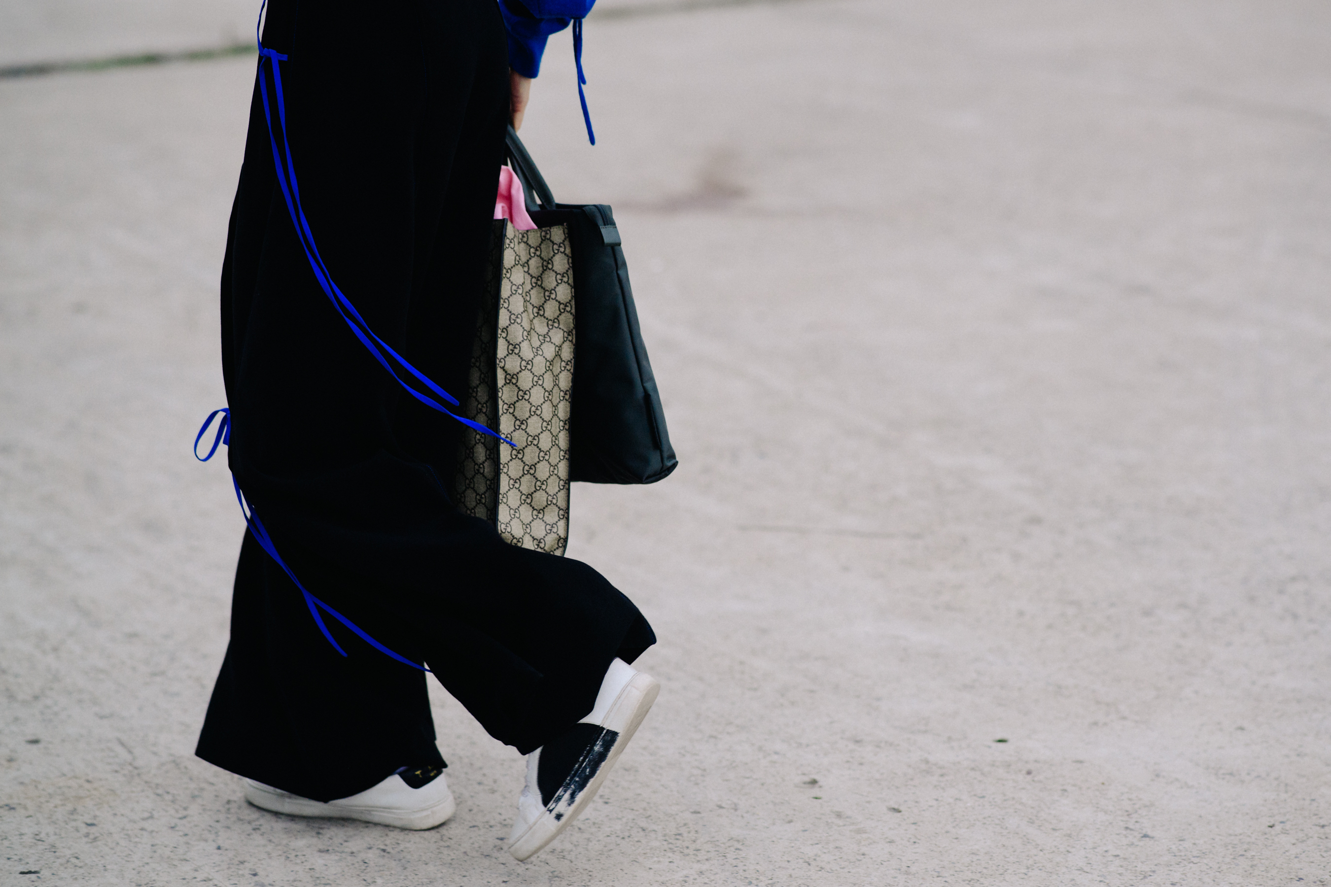 Closeup of womans feet in white sneakers