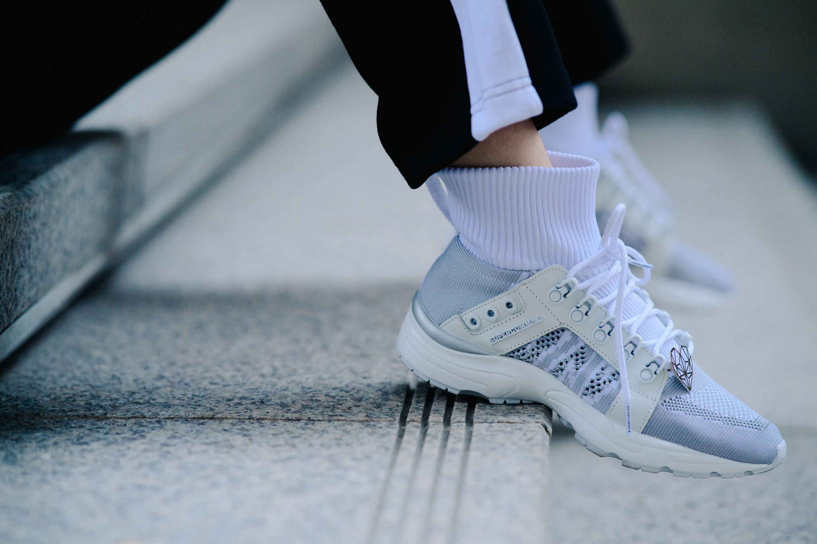 Closeup of white high top sneakers